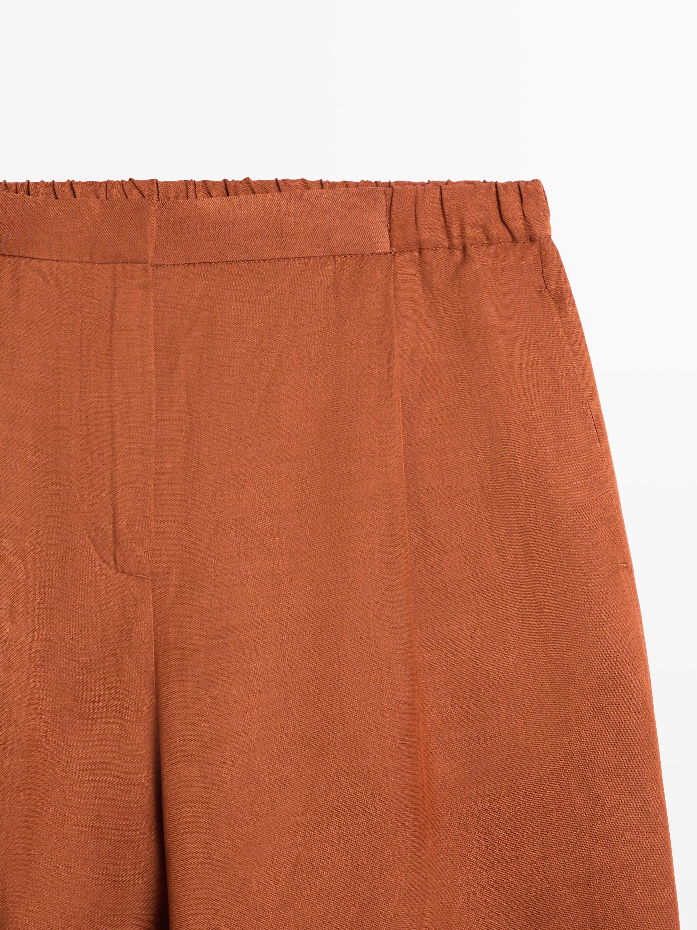 Flowing trousers with tie detail