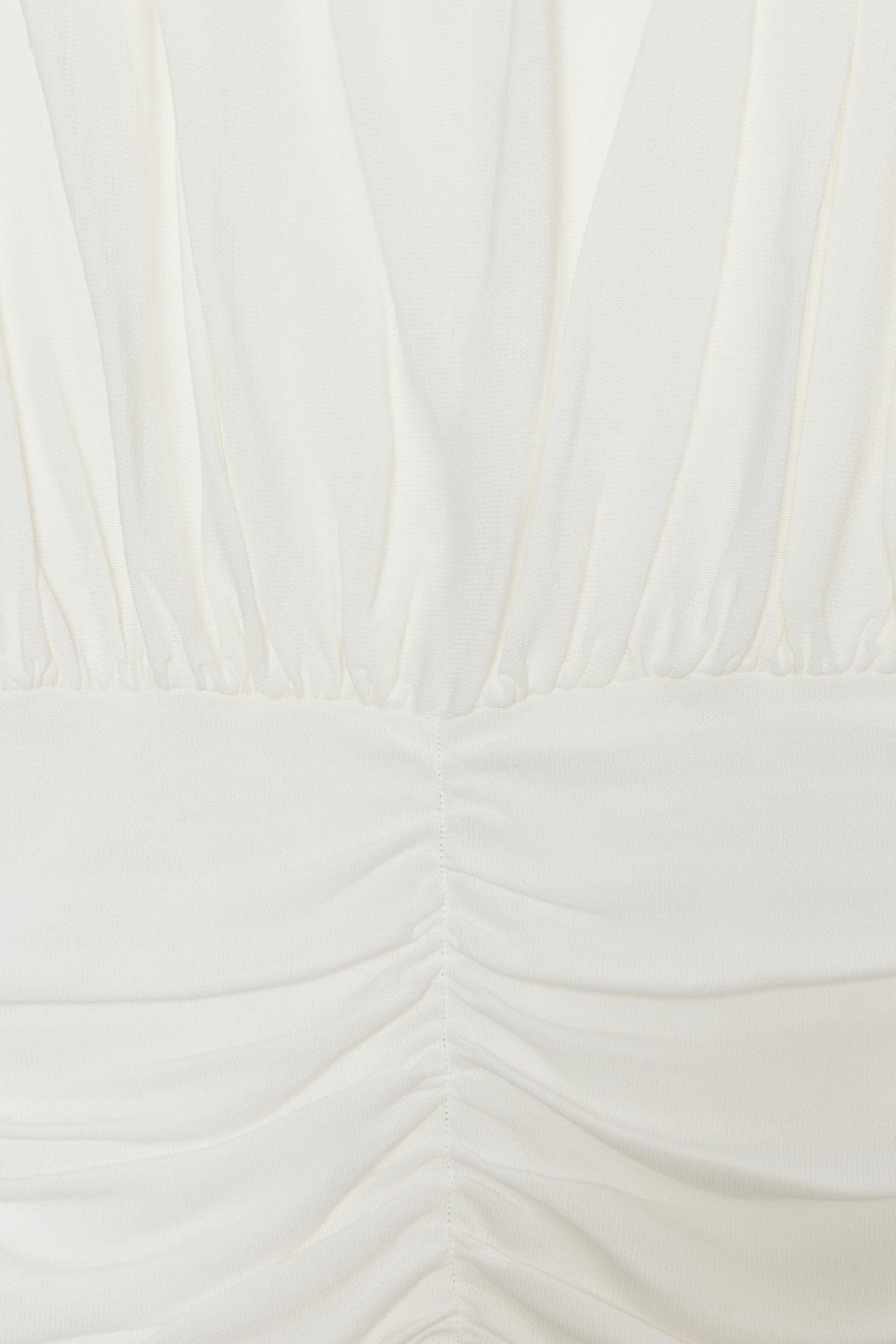 TOP DRAPÉ EN MAILLE