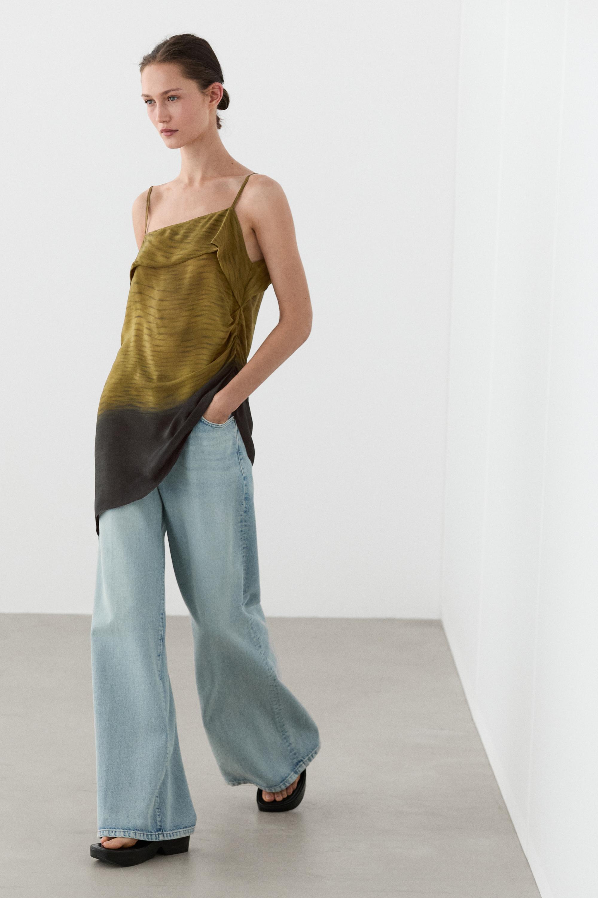 Asymmetric strappy top with draped detail