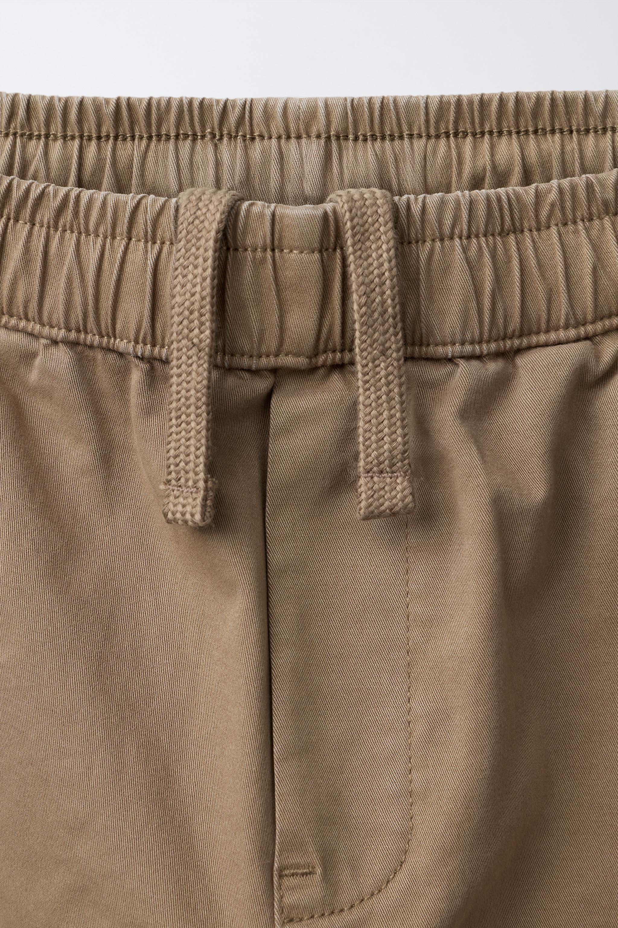 PLEATED STRAIGHT LEG PANTS