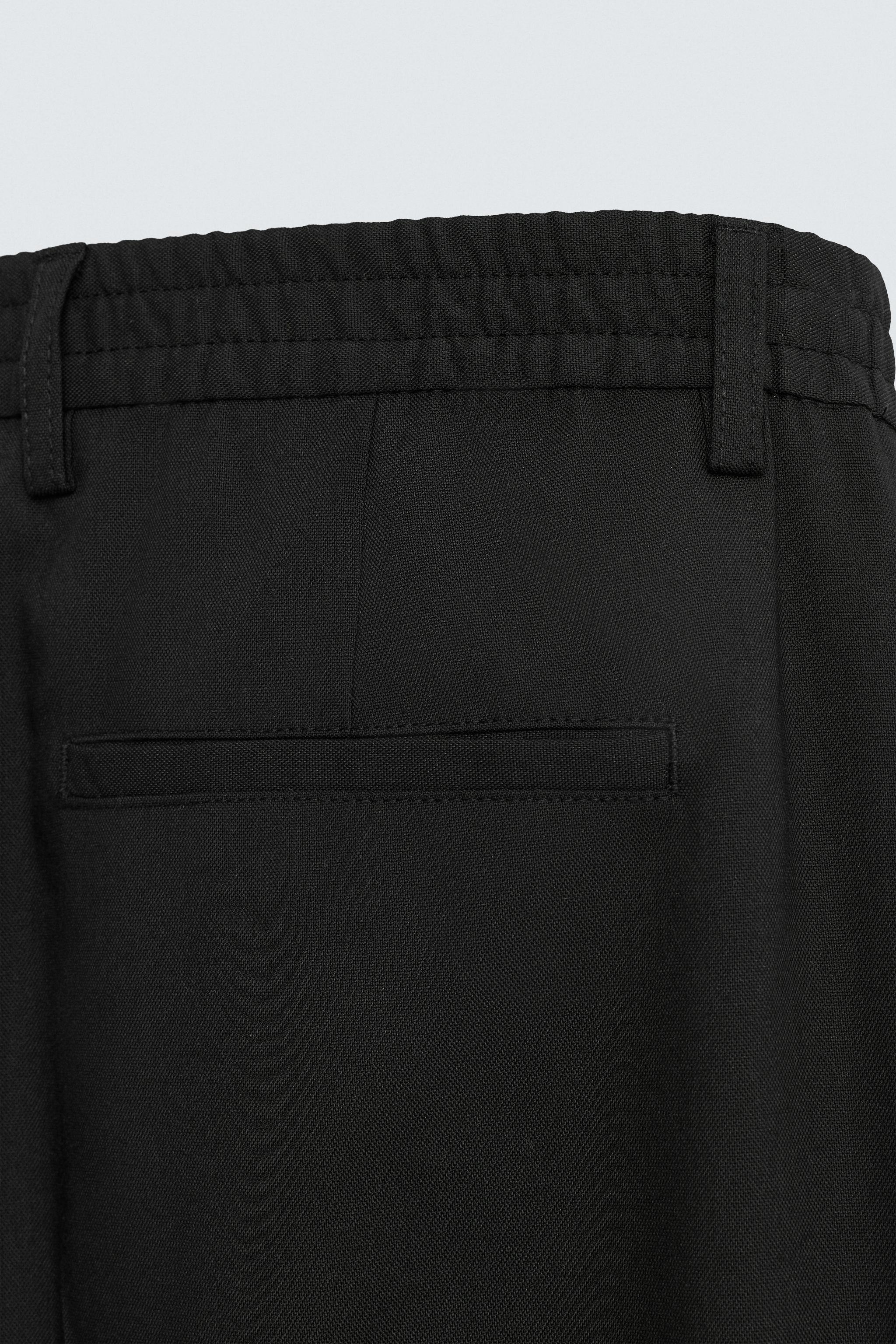 FLOWY PLEATED WIDE FIT PANTS