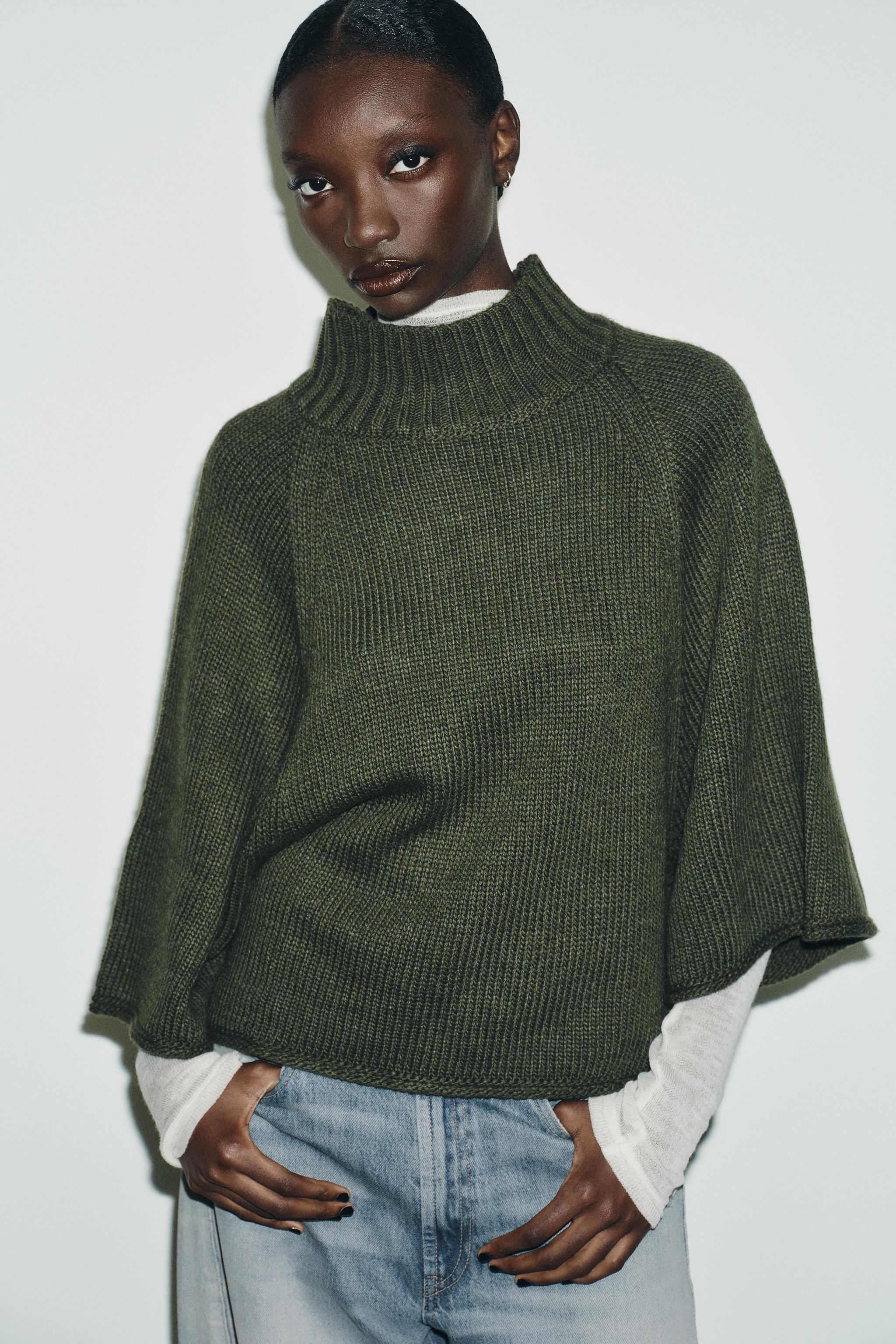 KNIT CAPE SWEATER