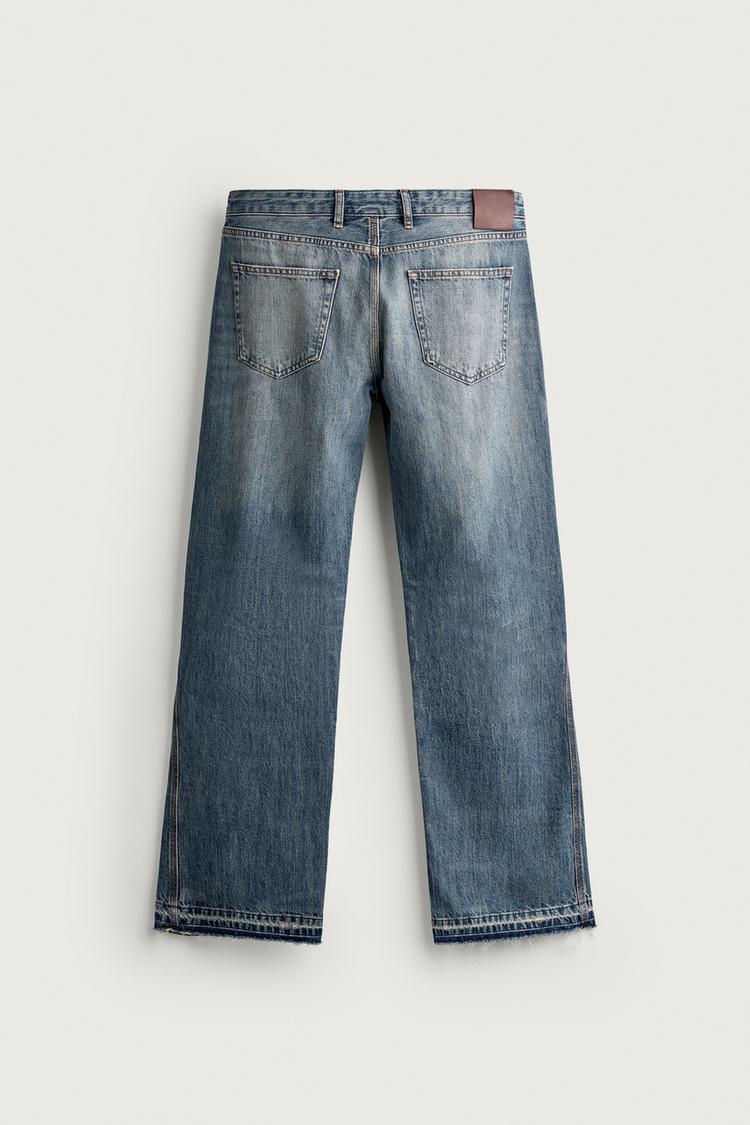 JEANS DE CINTURA BAJA CON ROTURAS Y PIERNA ACAMPANADA 7