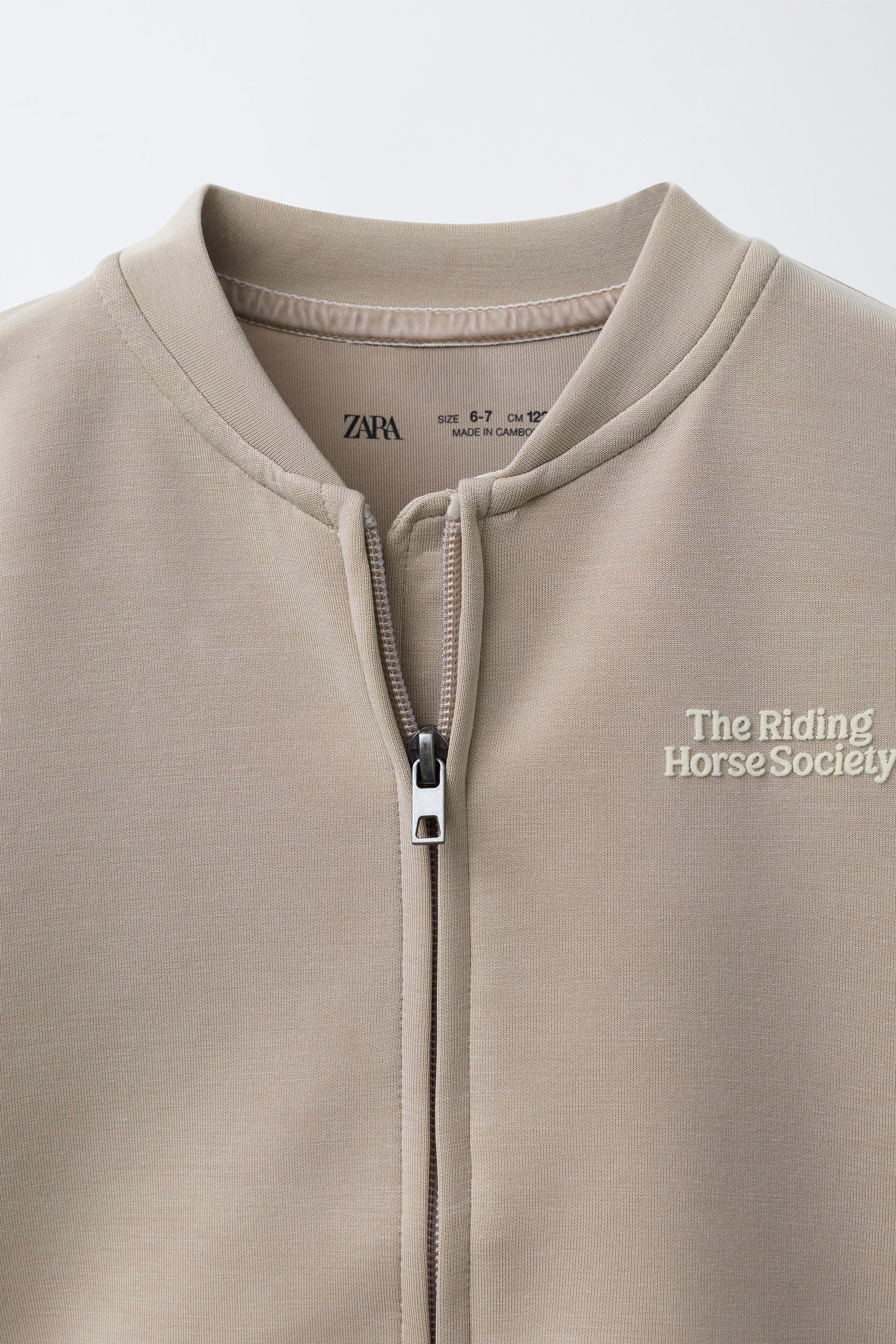 RAISED TEXT SWEATSHIRT