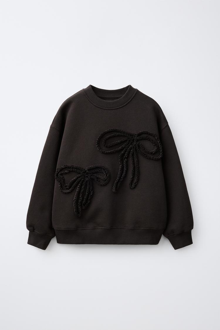 Sudadera aplique lazos