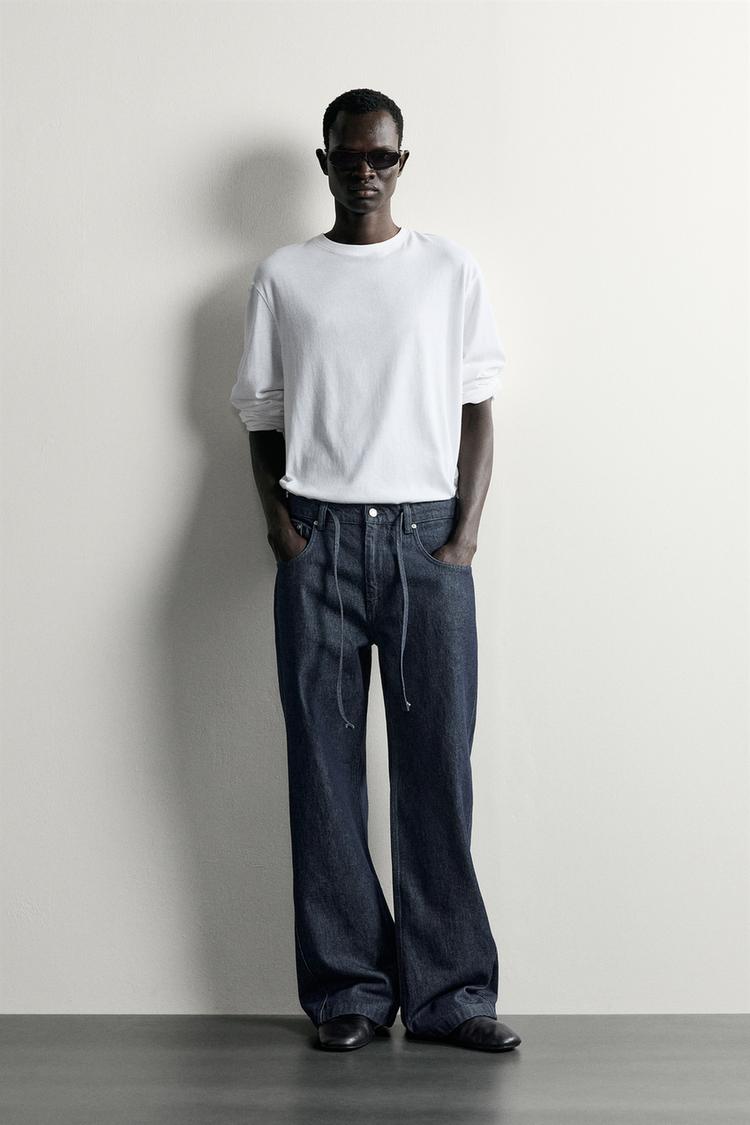 RELAXED FIT JEANS WITH TWISTED SEAMS