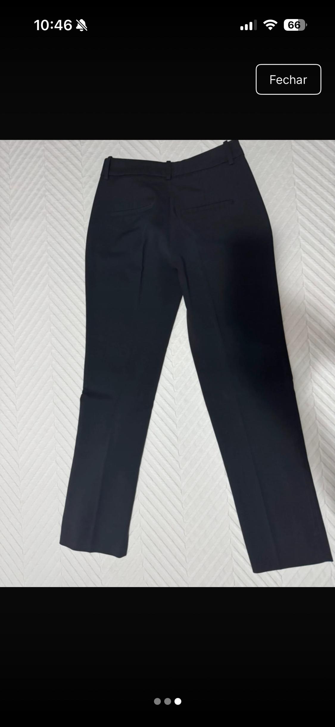 Dark trousers seen from behind on textured white fabric. Text: 10:46, 66, Close.