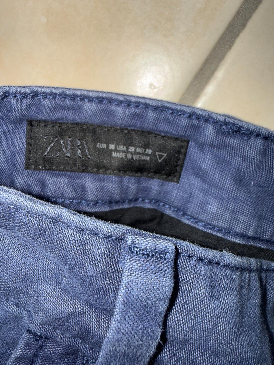 RELAXED FIT PLEATED JEANS - Image 3