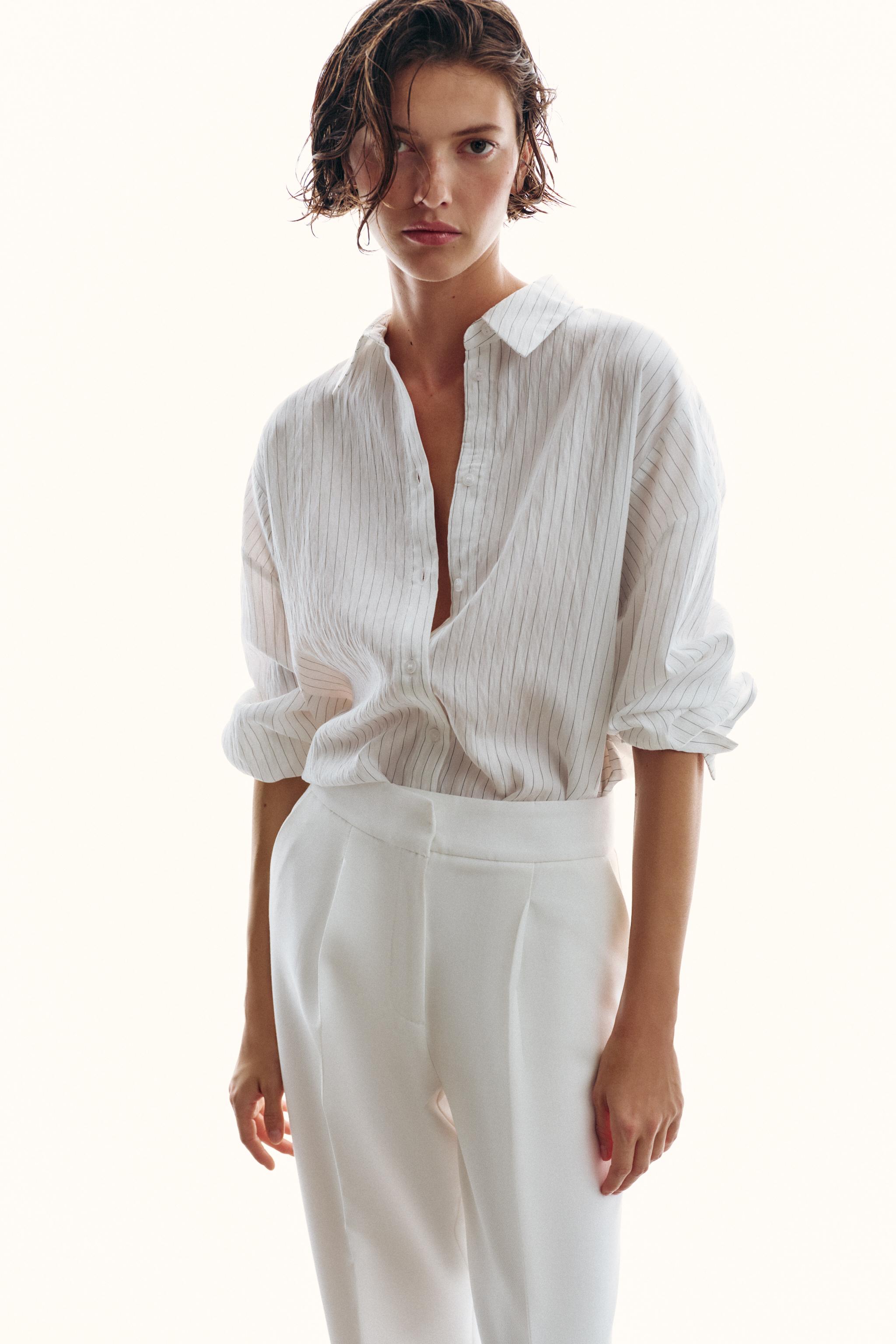 PANTALON À PLIS ET BAS REVERS