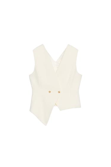 Front view of a white waistcoat with a double-breasted fastening and gold buttons.