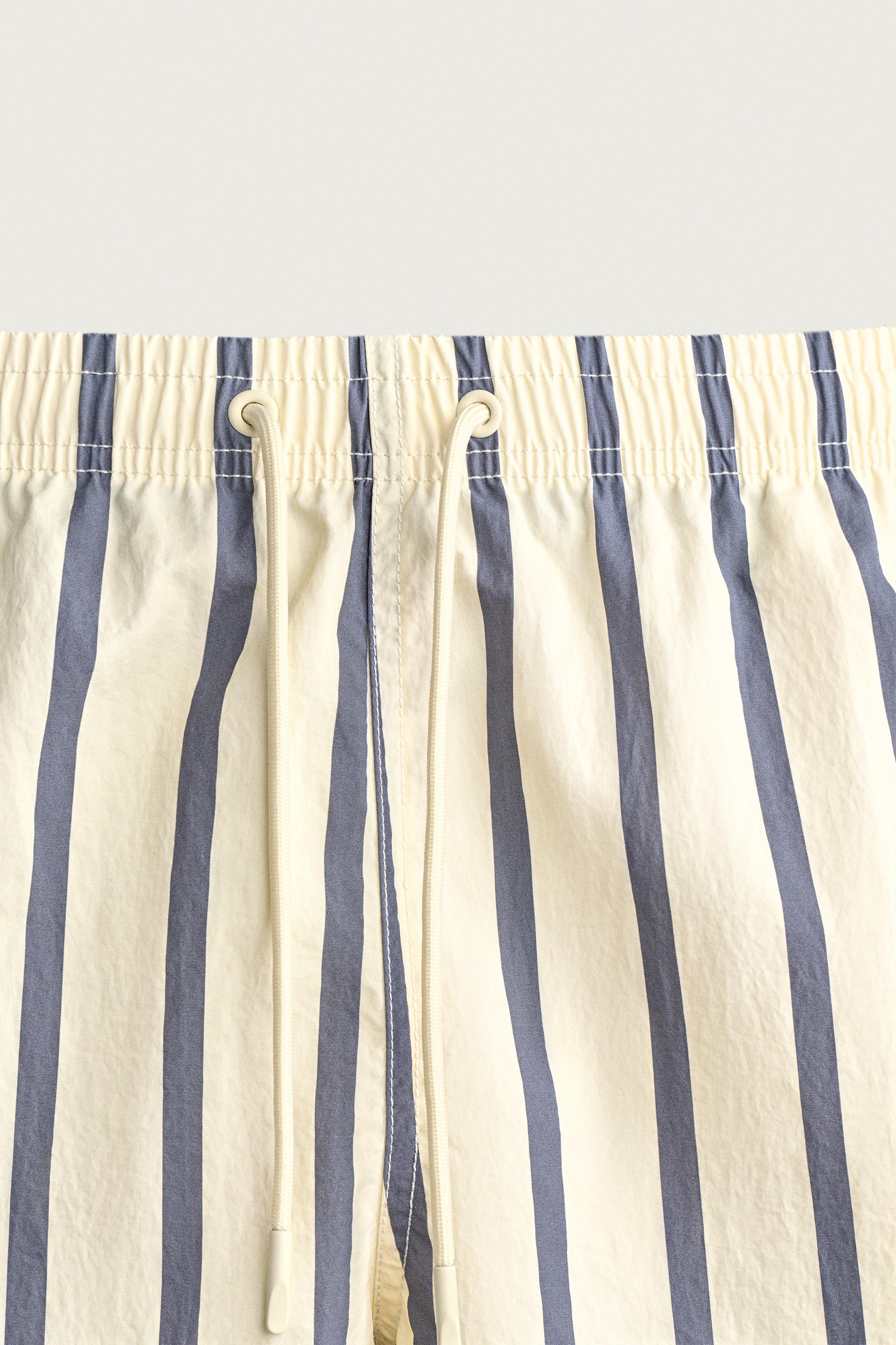 STRIPED MID-LENGTH SWIM SHORTS