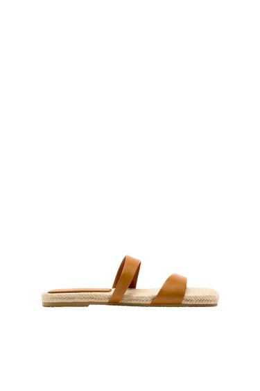 FLAT LEATHER SANDALS WITH CRISS-CROSS STRAPS