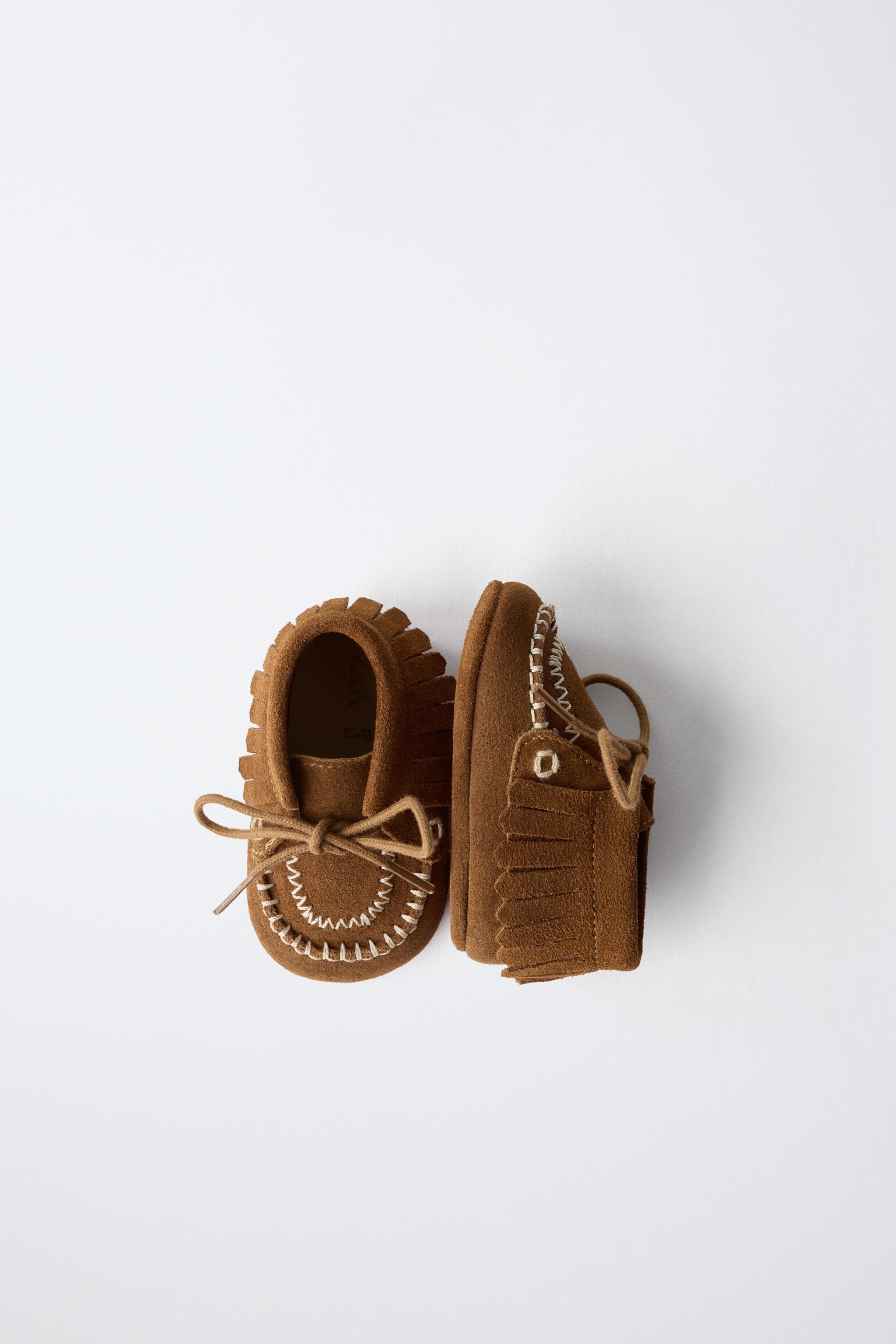 BOTTINES EN CUIR À FRANGES