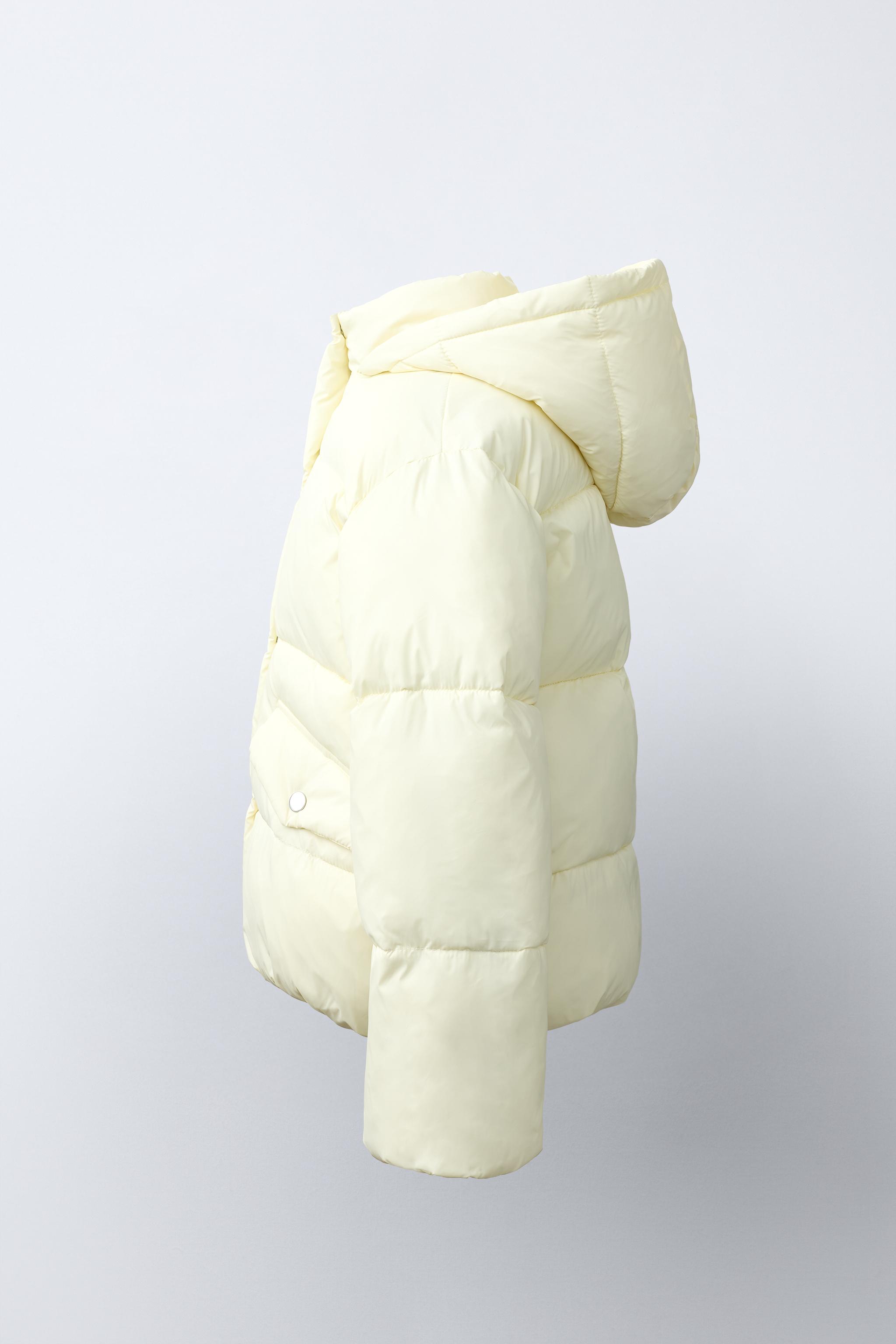 BLOUSON MATELASSÉ À CAPUCHE DÉPERLANT