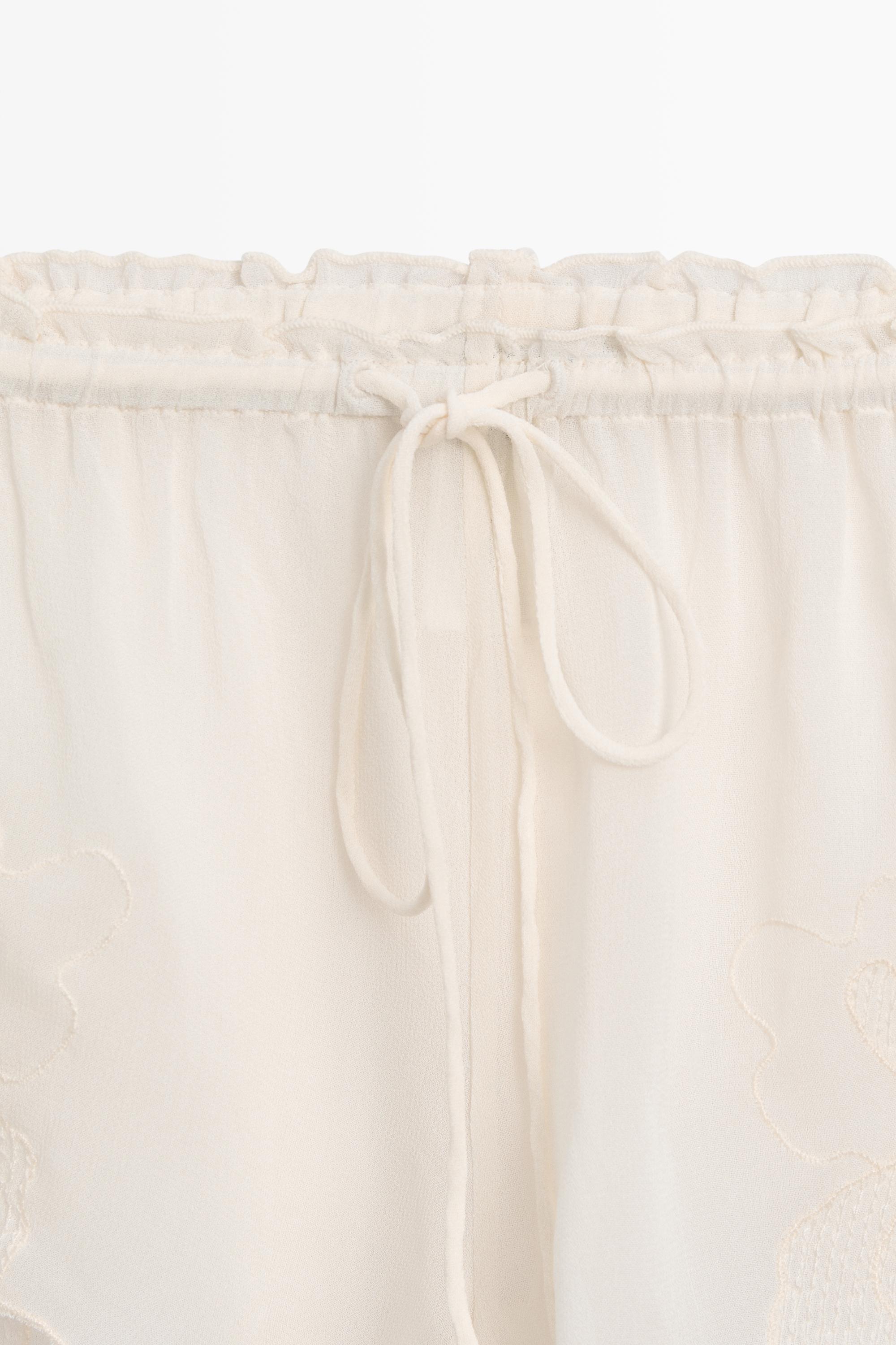 Flowing shorts with embroidered detail