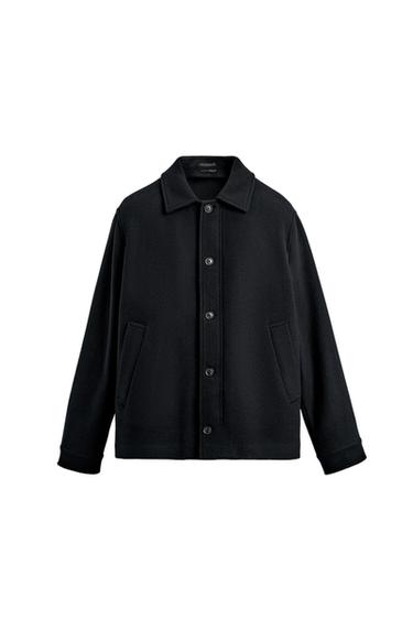 Front view of a navy blue jacket with a lapel collar, button fastening, and side pockets.