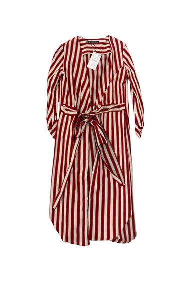 Front view of a red and white striped dress with a bow at the waist and a visible label.