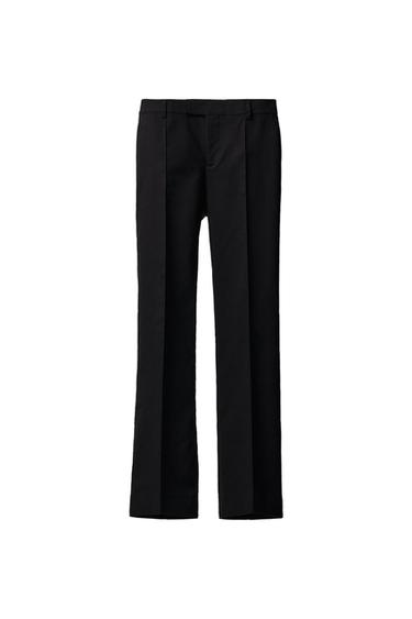 Front view of straight black trousers with pleats and side pockets.