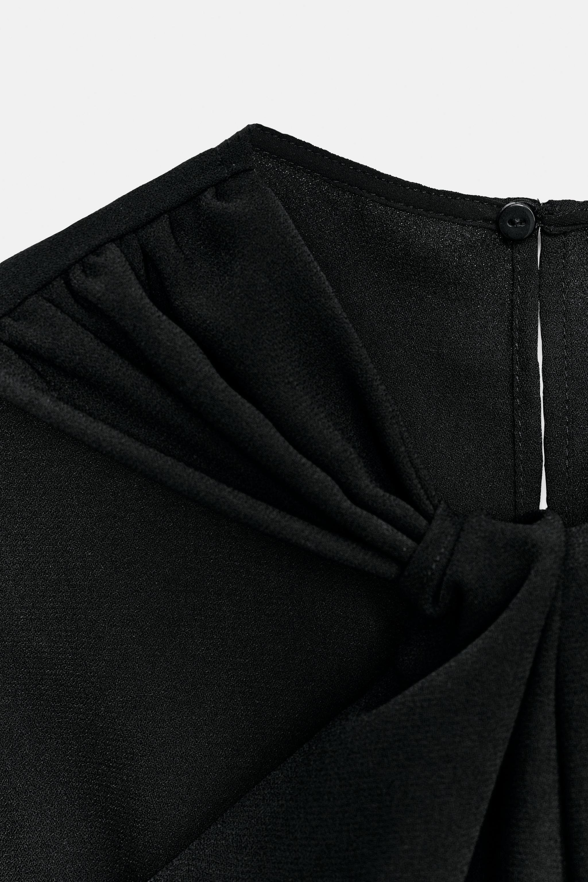 TWISTED NECK FLARE JUMPSUIT