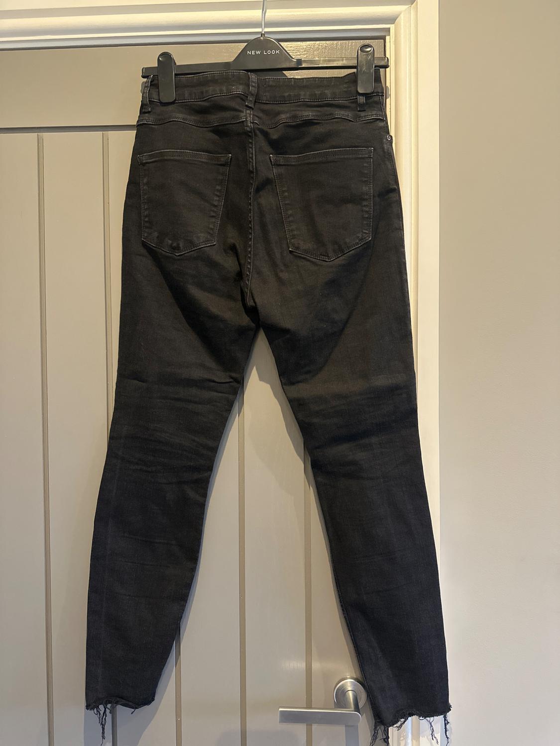 HIGH RISE JEANS WITH RIPS - Image 2