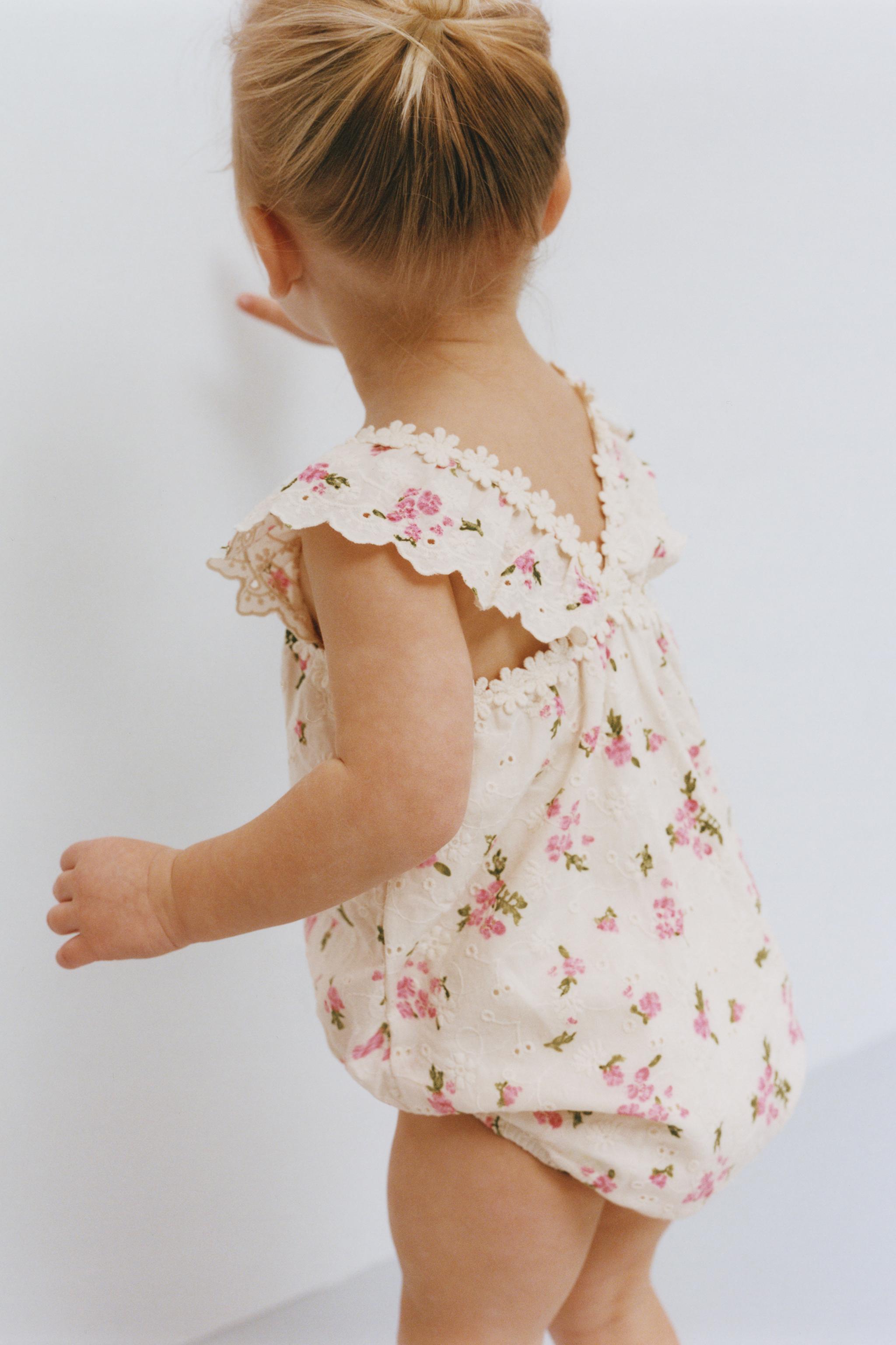 FLORAL EYELET ROMPER