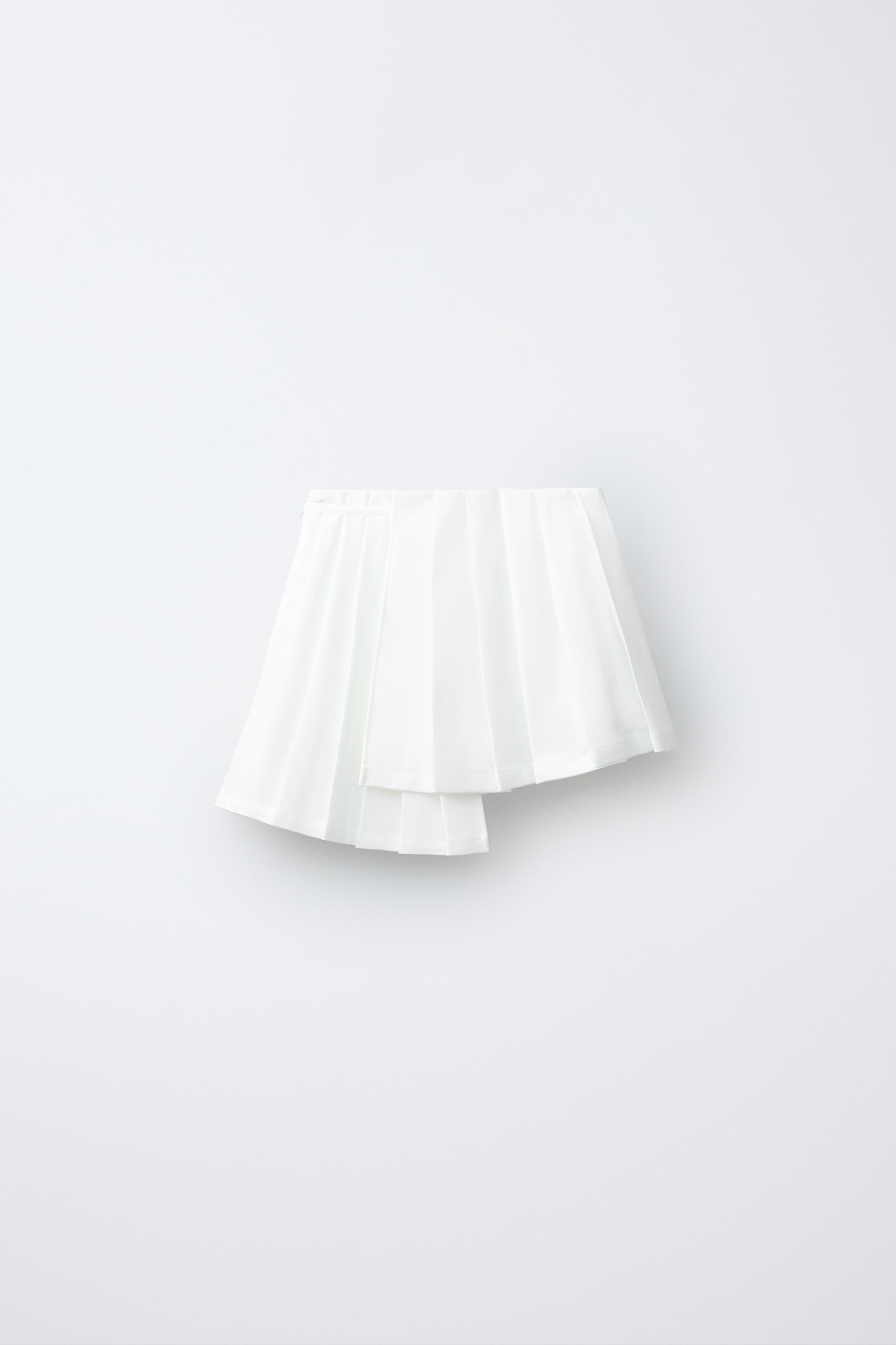 PENN © ASYMMETRIC PLEATED SKIRT