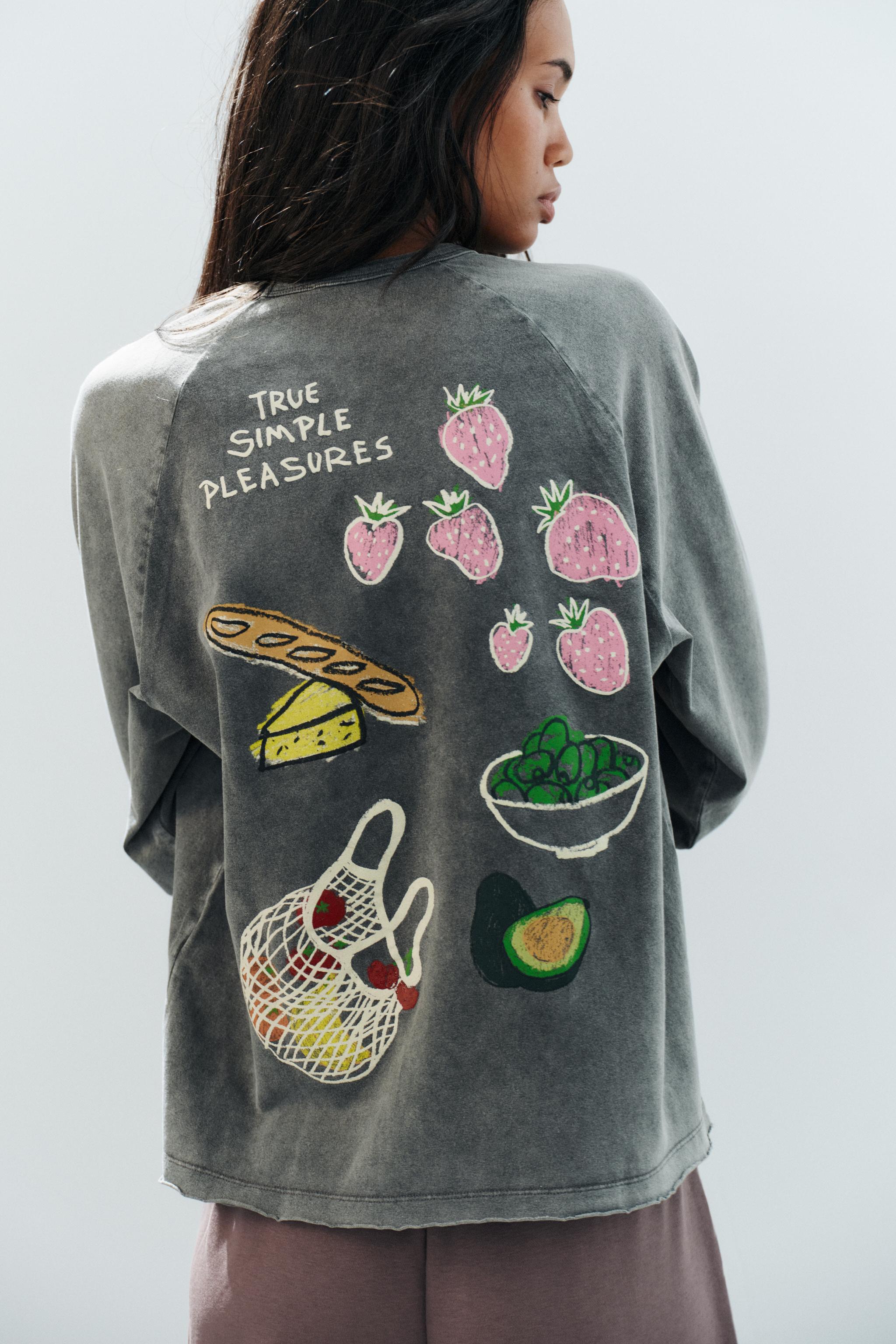 T-SHIRT À EFFET DÉLAVÉ ET DESSINS