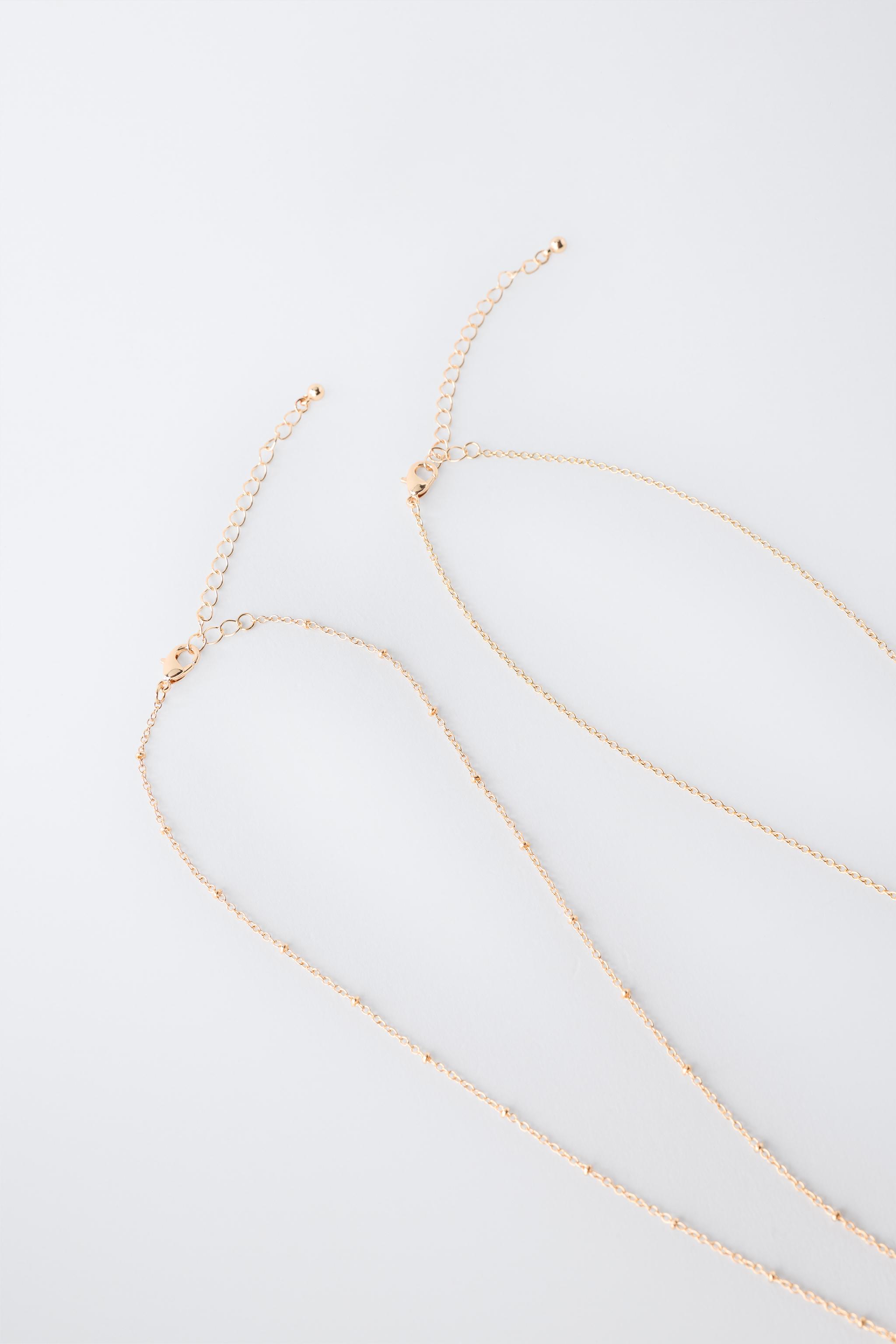 Детские аксессуары Zara TWO-PACK OF DOLPHIN AND HIBISCUS PENDANT NECKLACES — фото 3