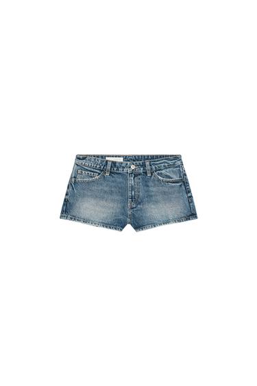Front view of blue denim shorts with front pockets and visible button.