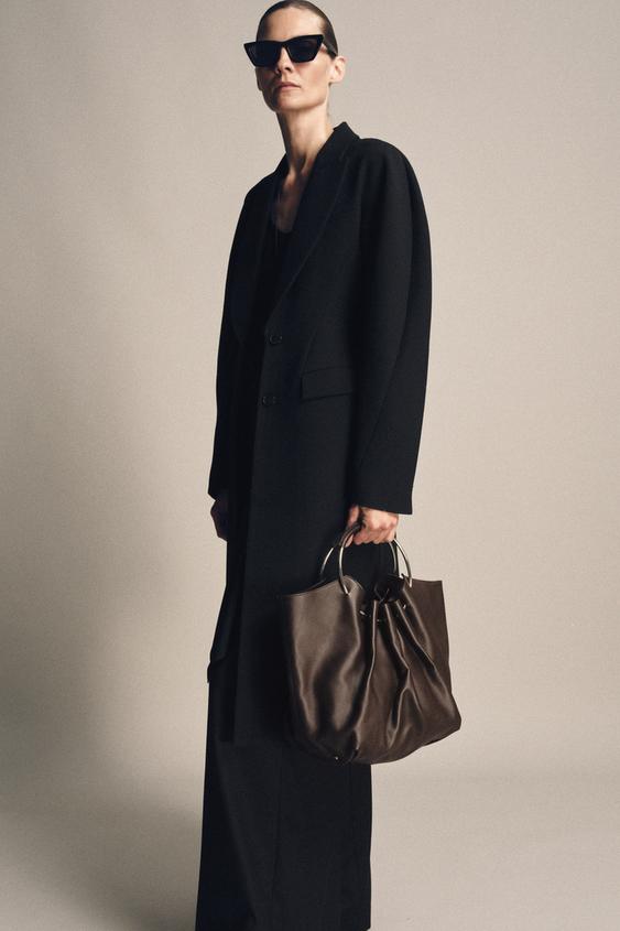 LEATHER BUCKET BAG WITH RIGID HANDLE