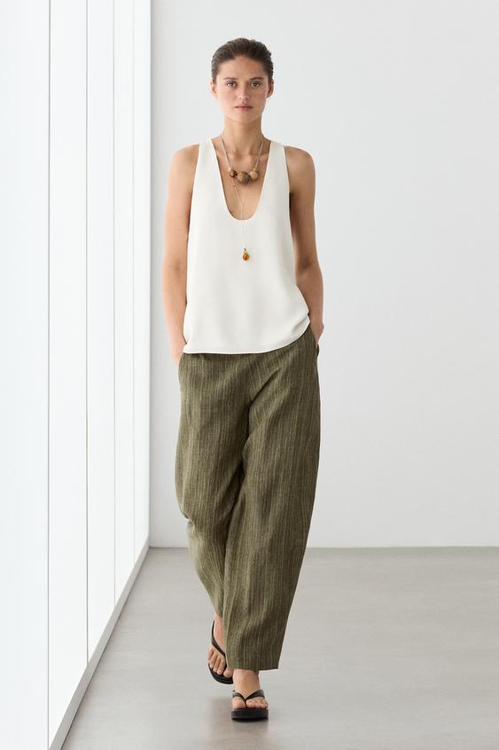 Total look linen trousers with corset belt detail from Zara - $180