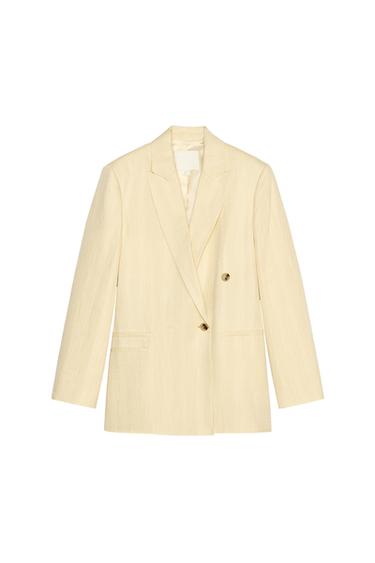 Front view of a beige blazer with lapel and gold buttons.