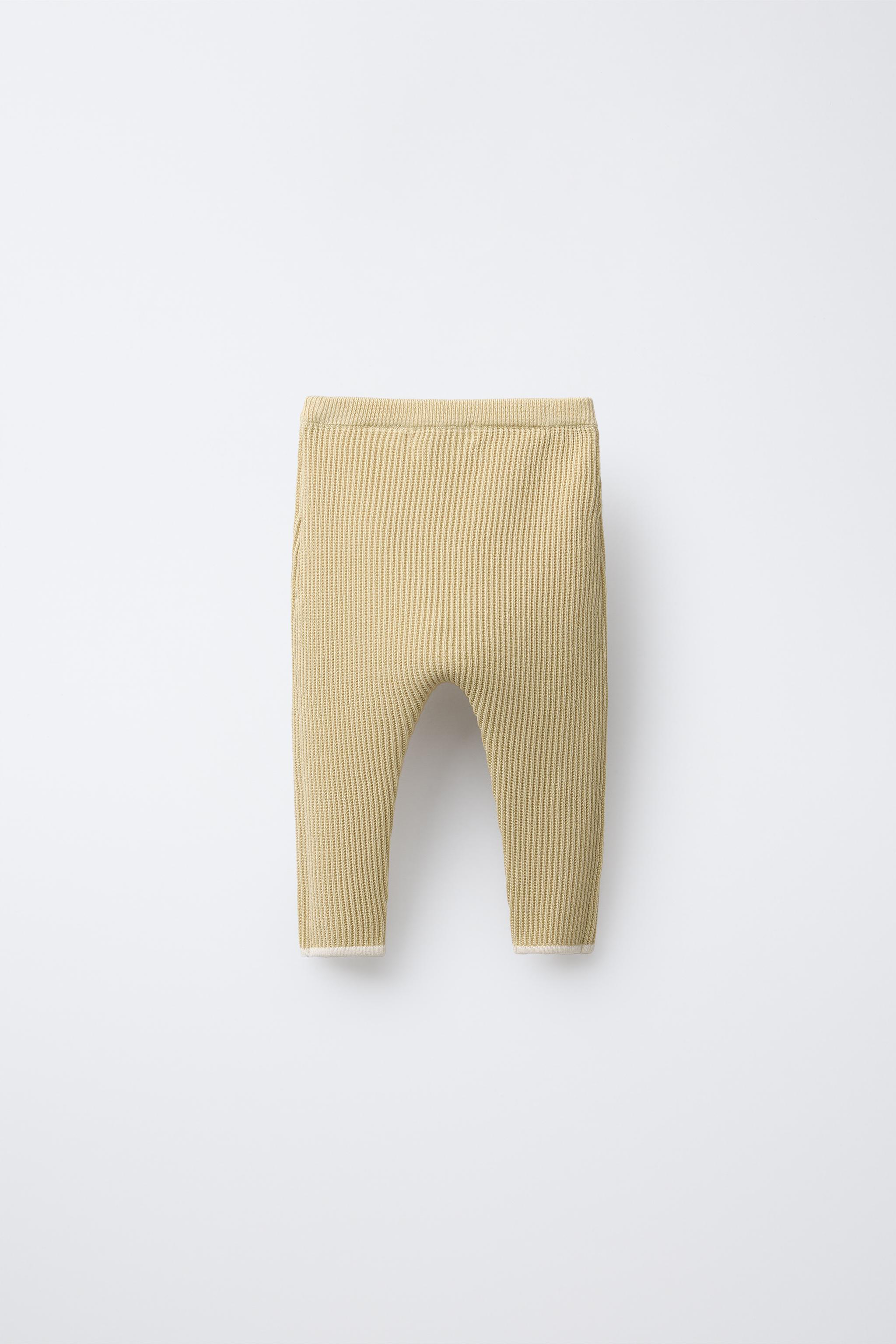 PANTS WITH CONTRASTING PIPING