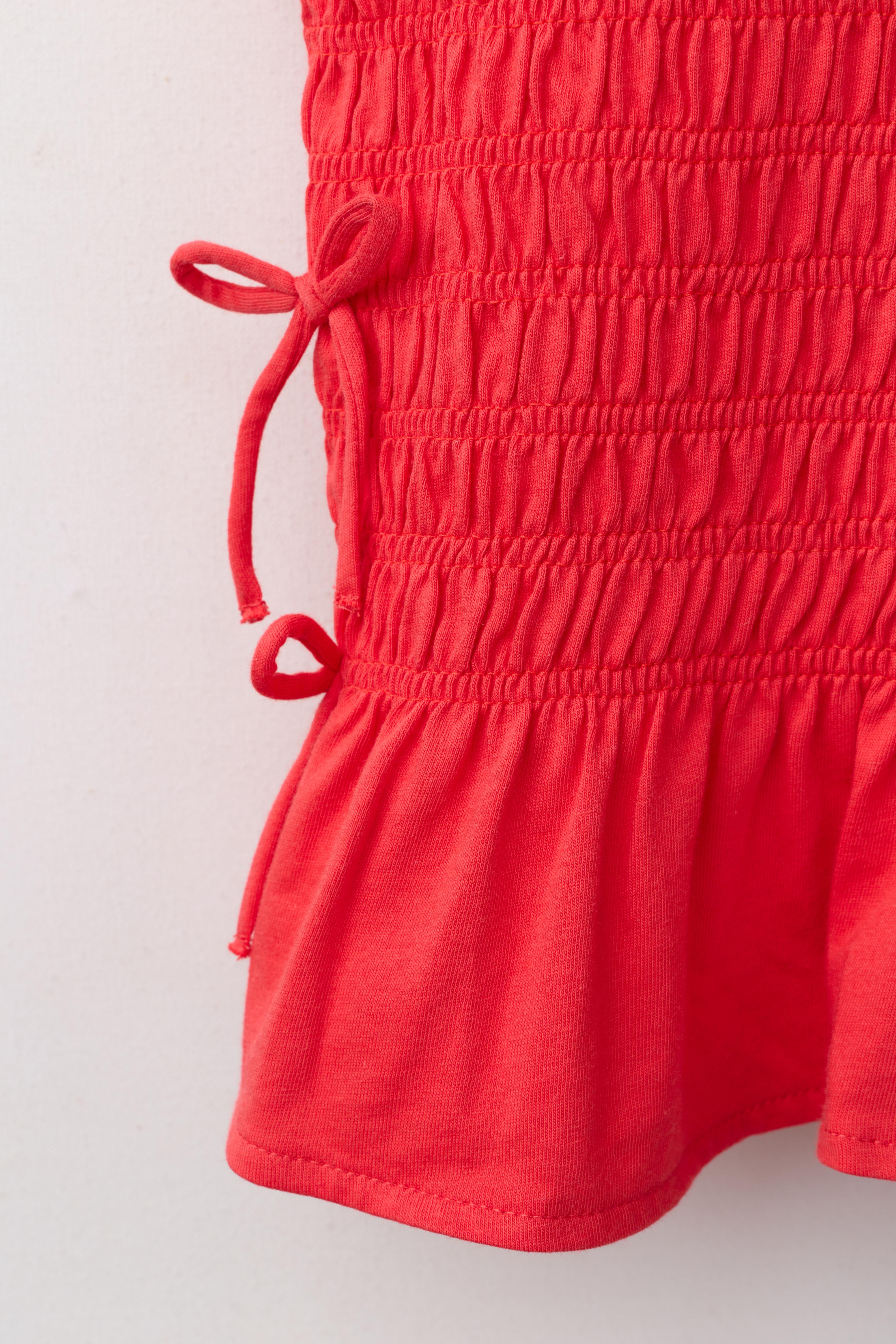 ELASTICIZED TIE TOP
