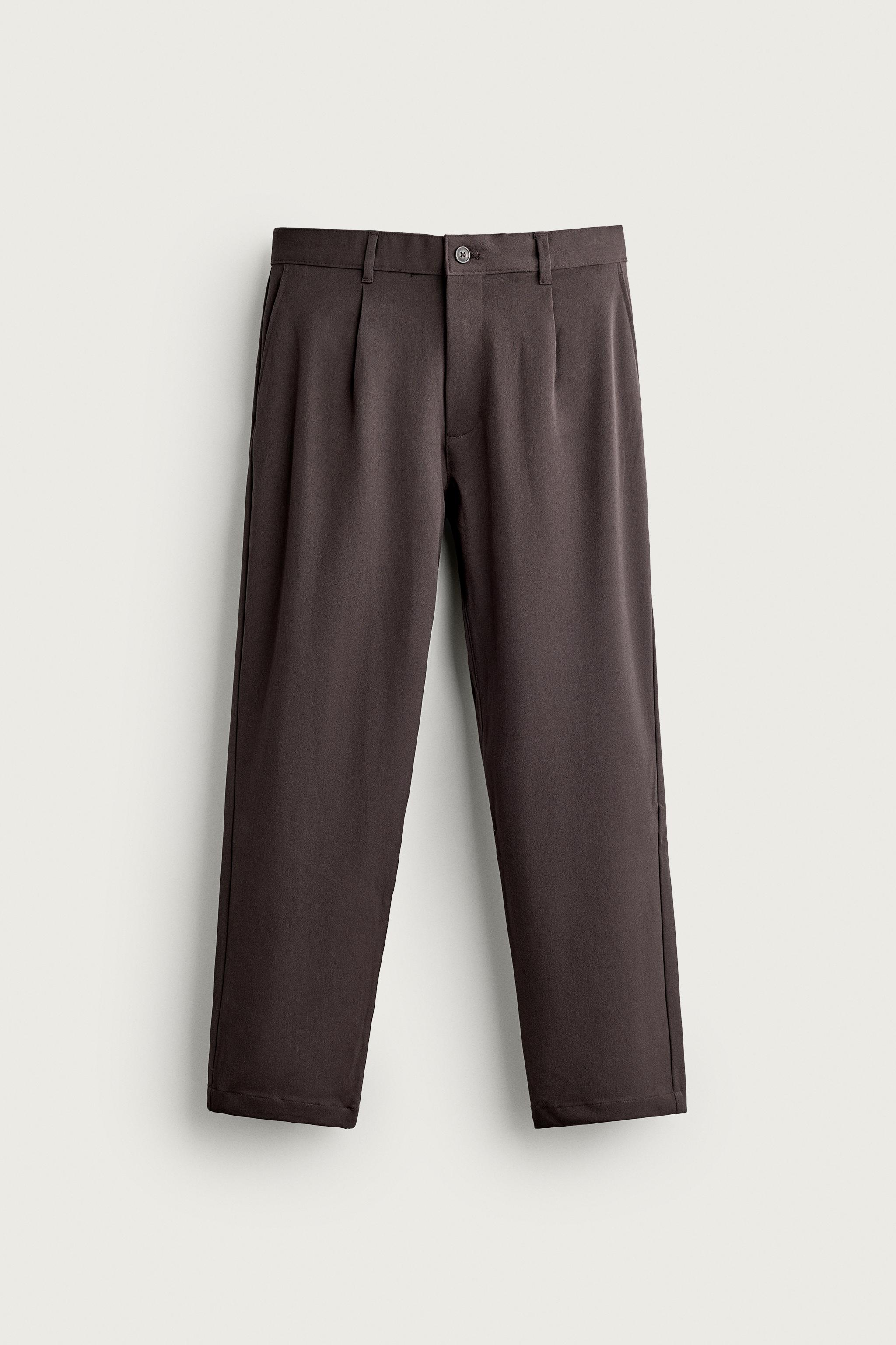 RELAXED FIT PLEATED PANTS — Brown