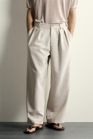 PANTALÓN RELAXED FIT ESTRUCTURA PLIEGUES - Beige claro de Zara