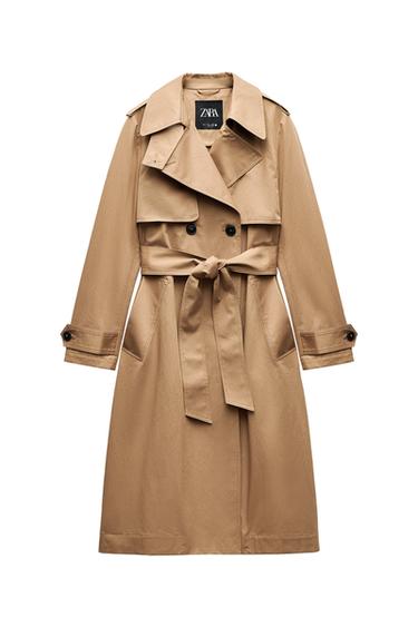 Front view of a beige coat with belt and side pockets.