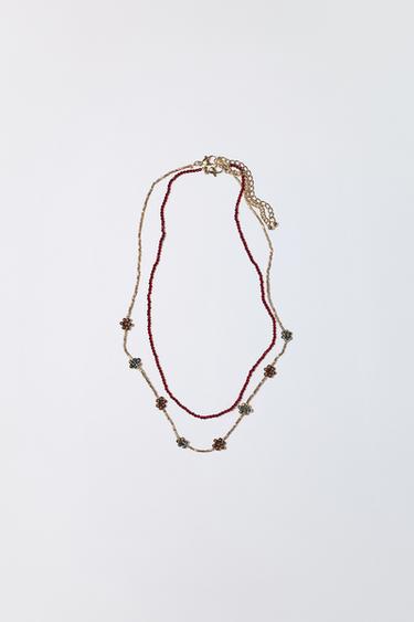 LOT DE DEUX COLLIERS FANTAISIE FLEURS - Grenat de Zara