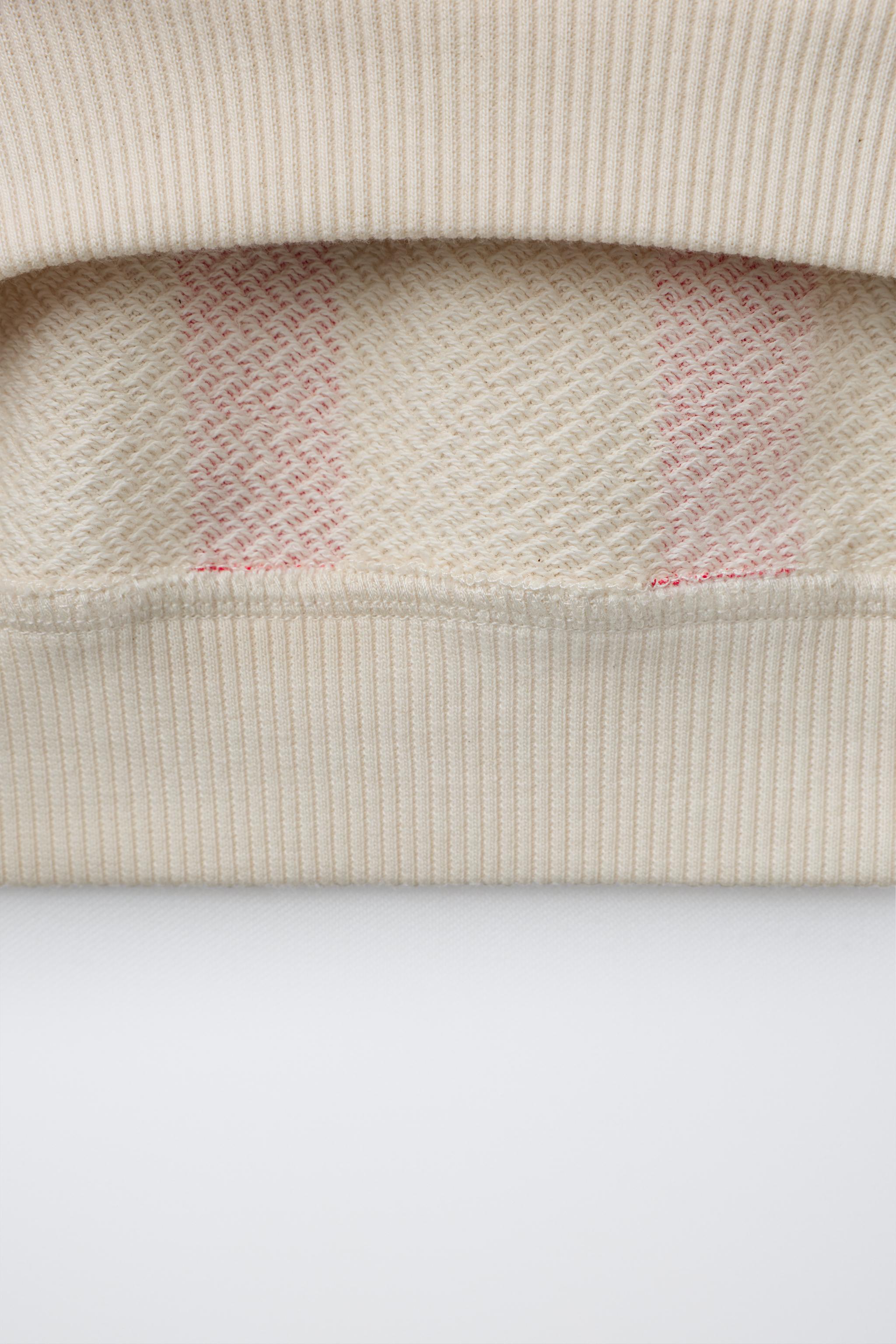 STRIPED SWEATSHIRT WITH RAISED TEXT