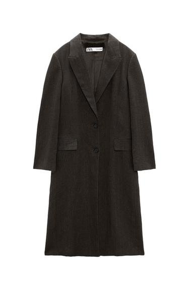 Black long coat with lapels and two front buttons. Visible label on the inside of the collar with the text "ZARA".