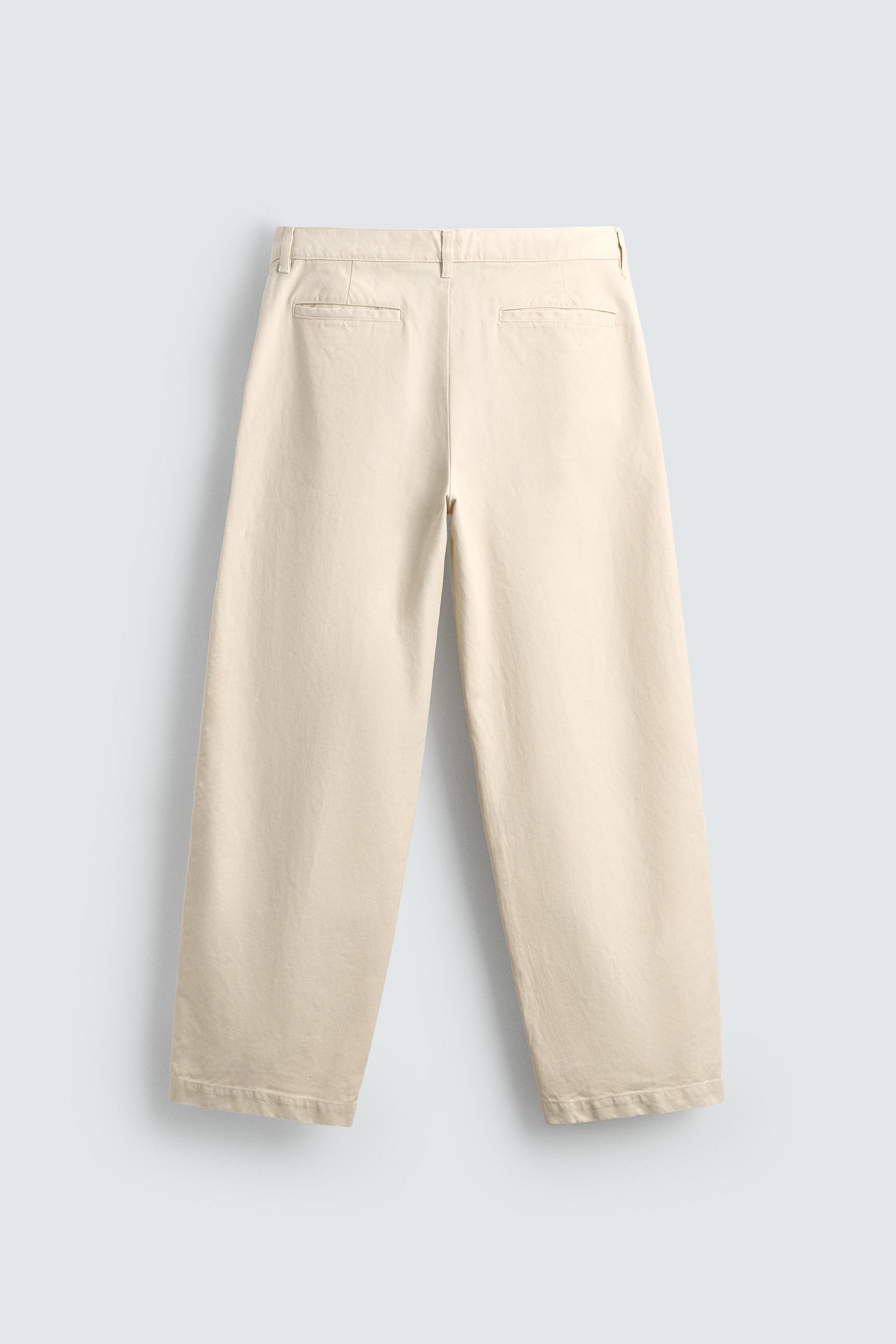 RELAXED FIT PLEATED PANTS