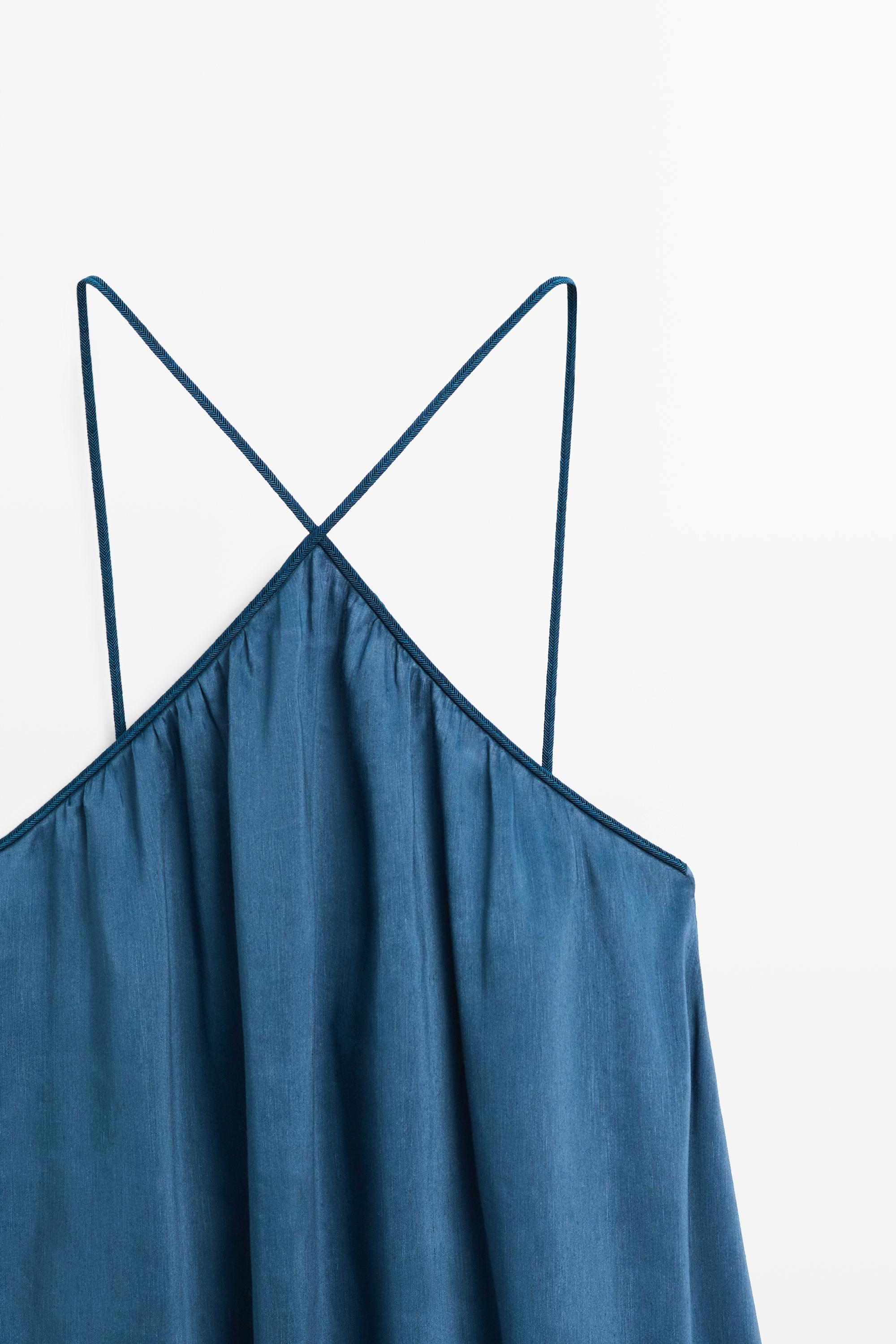 Long flowing dress with criss-cross straps