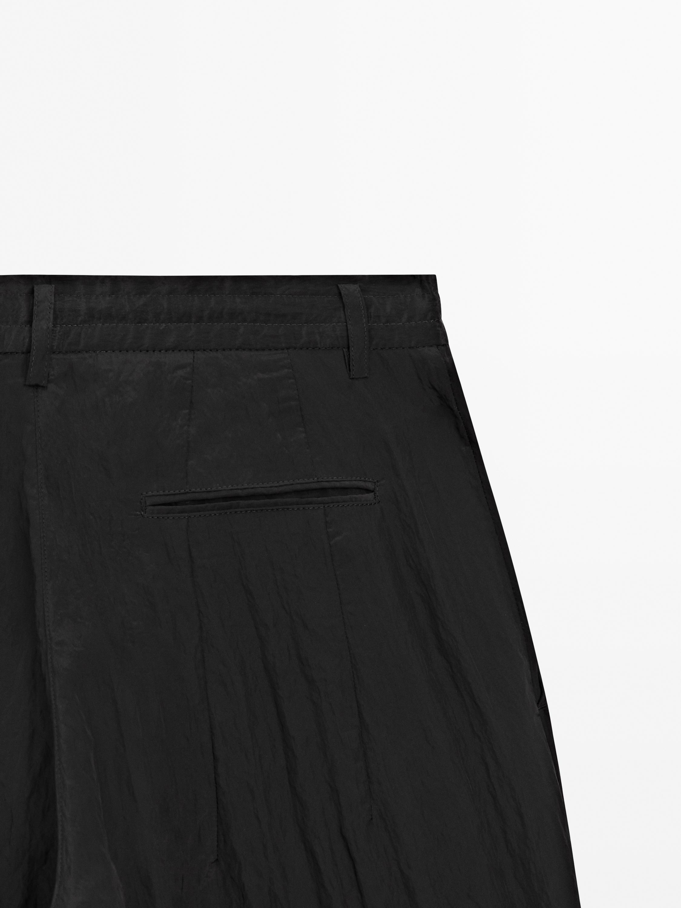 Creased-effect darted technical trousers - Limited Edition - Black