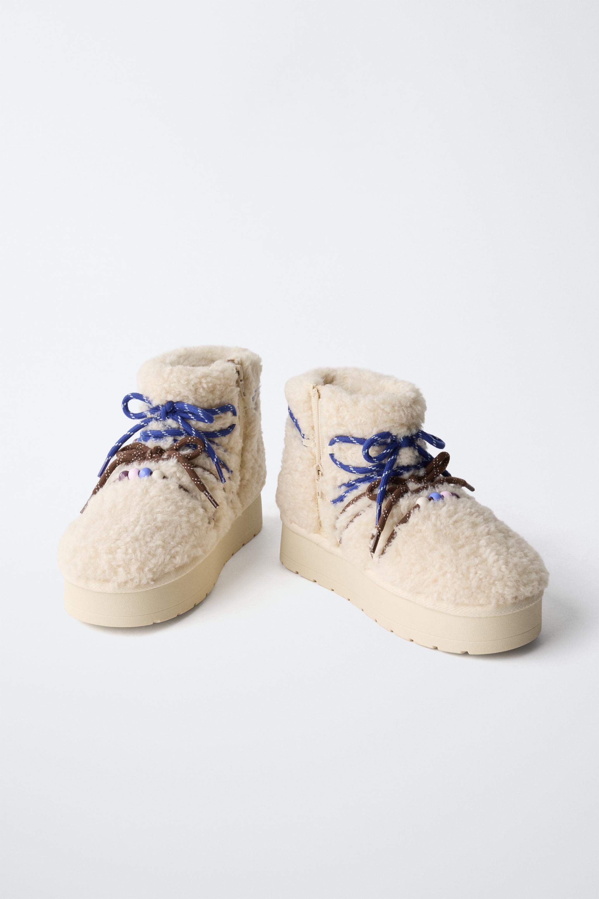BOTTINES EN PEAU DE MOUTON CHARMS