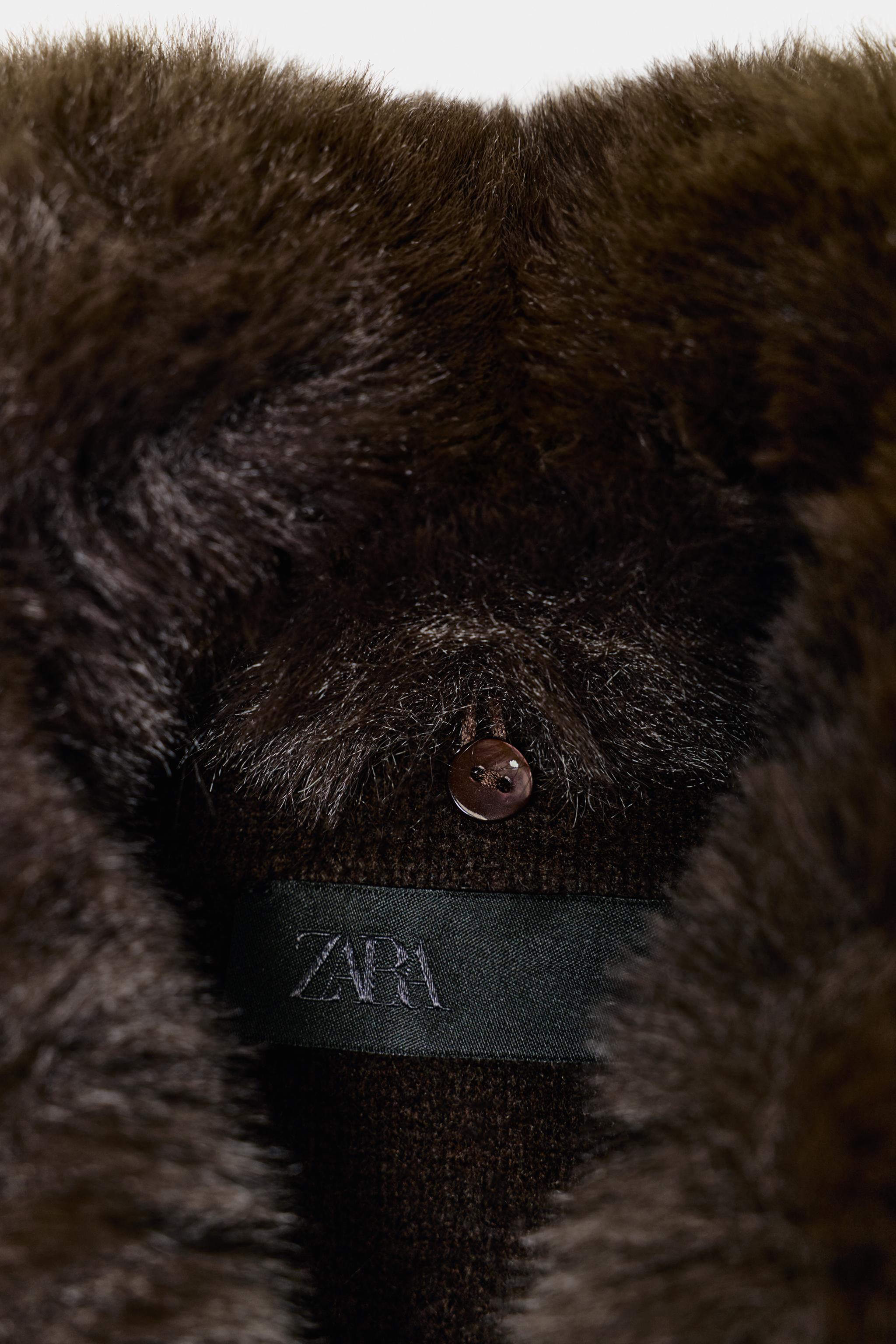 VESTE EN MAILLE AVEC COL EFFET FOURRURE