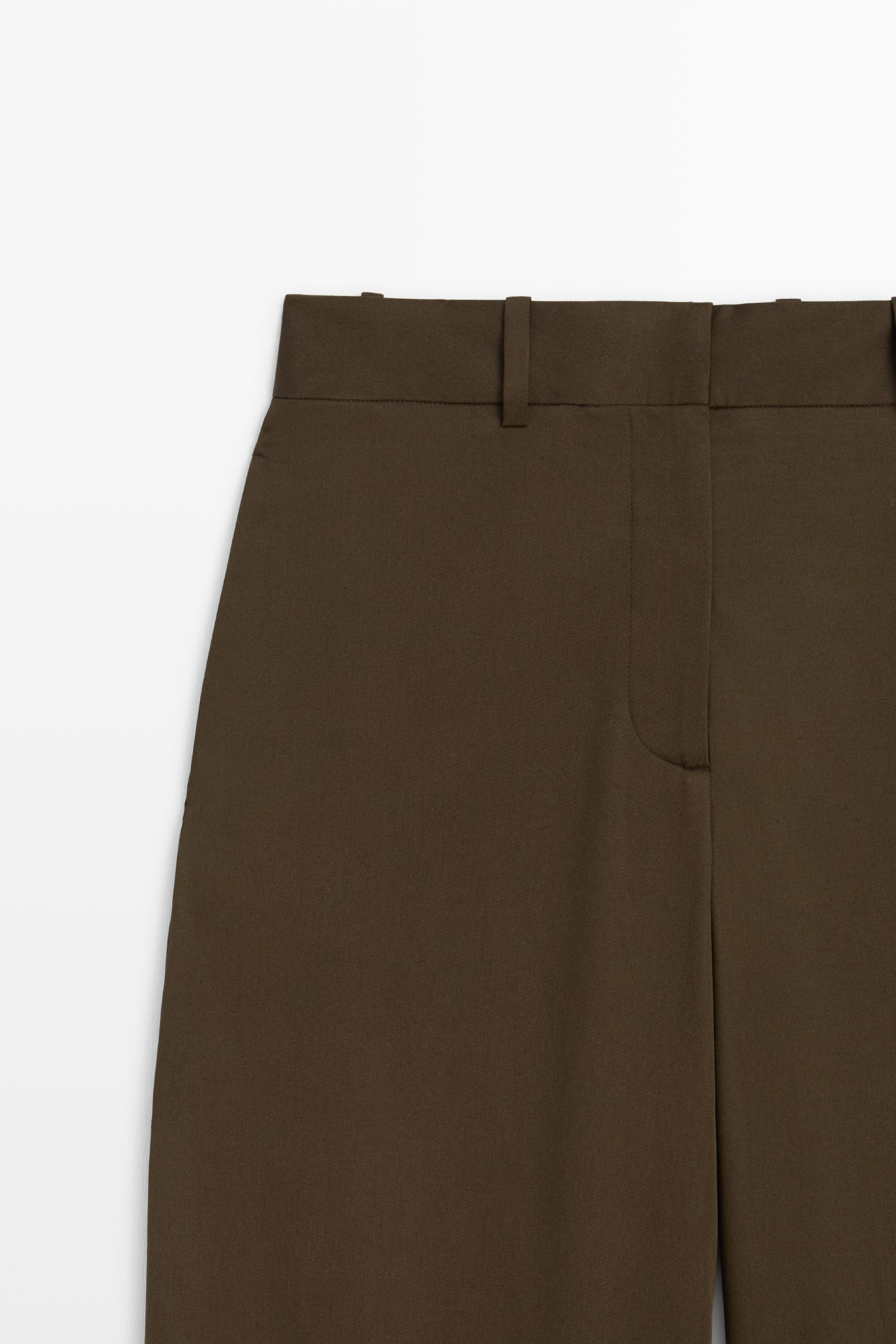 Pants with button-tab hem detail