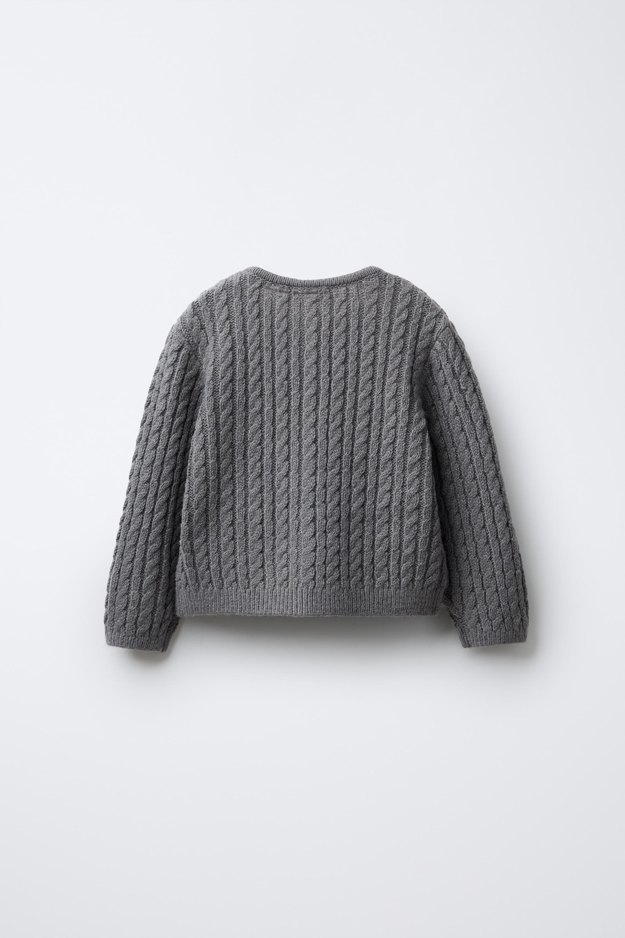 GILET EN MAILLE TORSADÉE BRODÉ AVEC LAINE