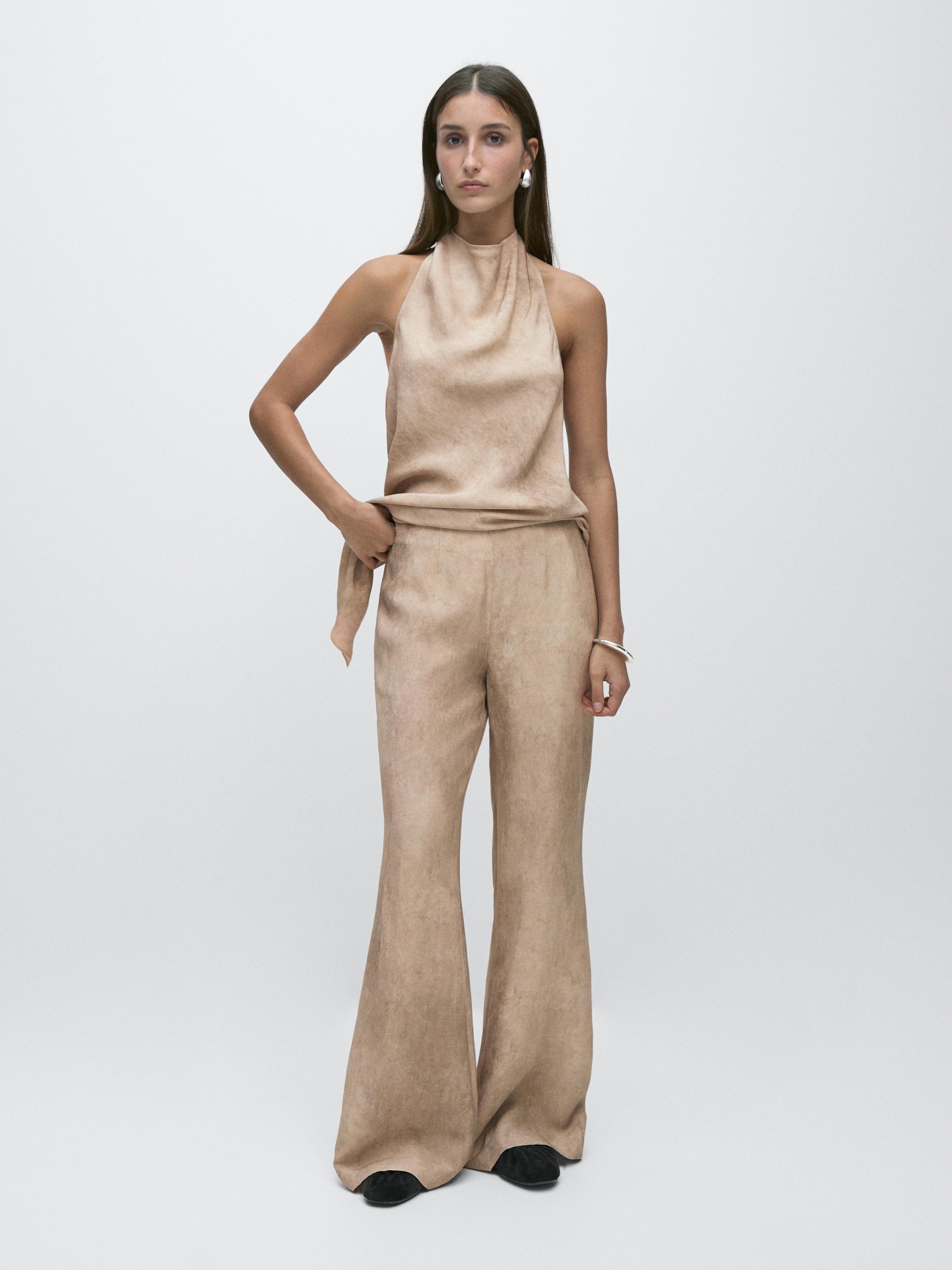 Distressed-effect flowing trousers — Stone