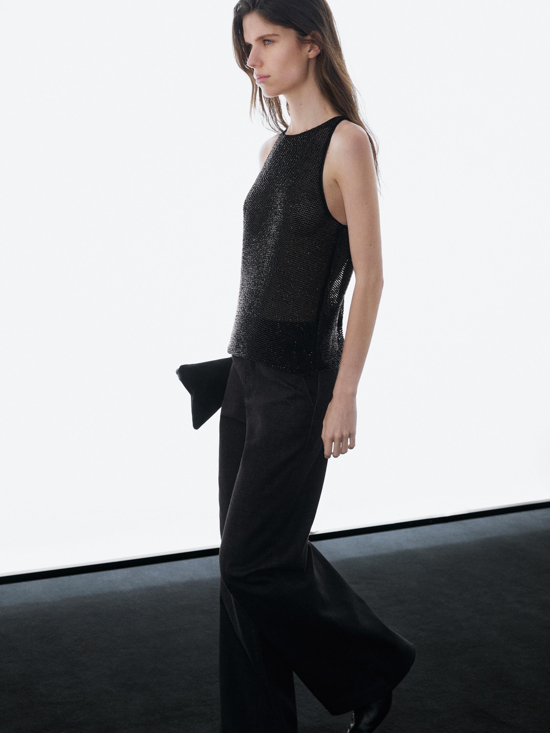 Semi-sheer top with matching beads