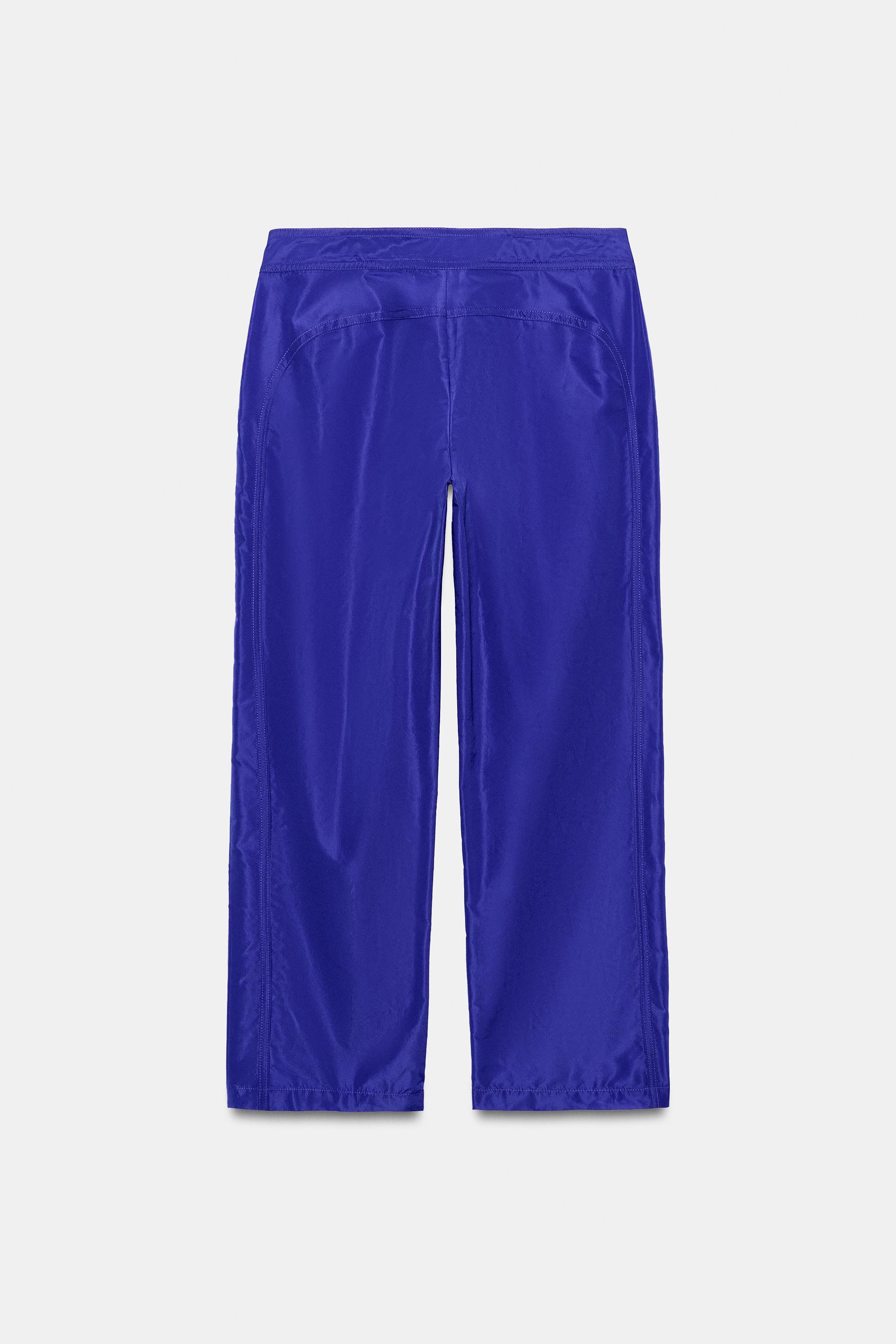 PANTALON EN NYLON COURT AVEC CORDONS